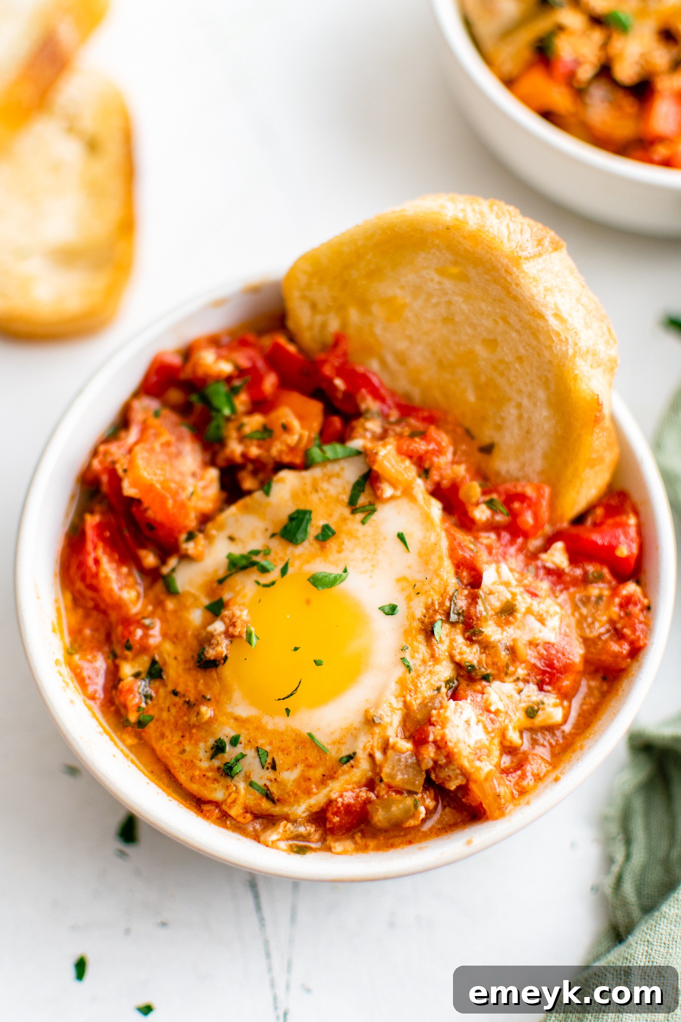 Easy Shakshuka served with crusty bread for dipping.