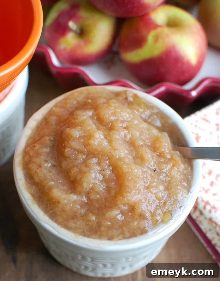 Homemade Crockpot Applesauce, simmering gently, offering a warm, sweet, and comforting aroma.