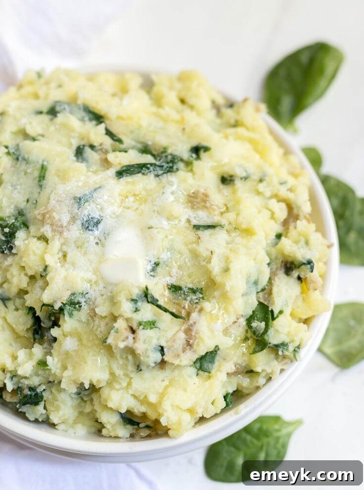 Creamy Whole 30 Mashed Potatoes with fresh spinach mixed in, offering a healthier, comforting side dish.
