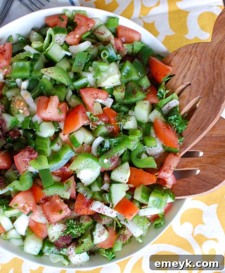 Fresh and vibrant Easy Lebanese Salad, also known as Salata, made with crisp lettuce, tomatoes, cucumbers, and a simple lemon-mint dressing.