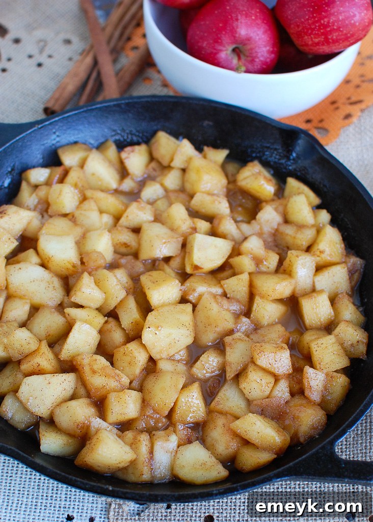 Warm and tender Easy Skillet Apples, gently cooked with spices, a sweet and simple side dish.