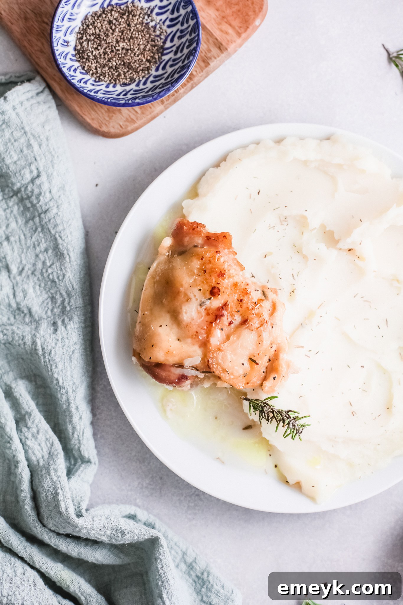 Instant Pot Creamy Rosemary Chicken with fresh rosemary sprigs.