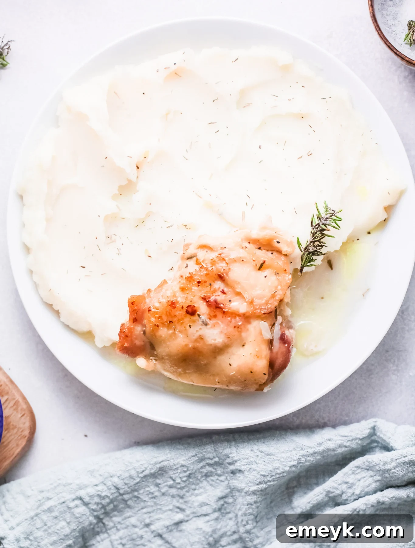 Instant Pot Creamy Rosemary Chicken served with a side of mashed potatoes.