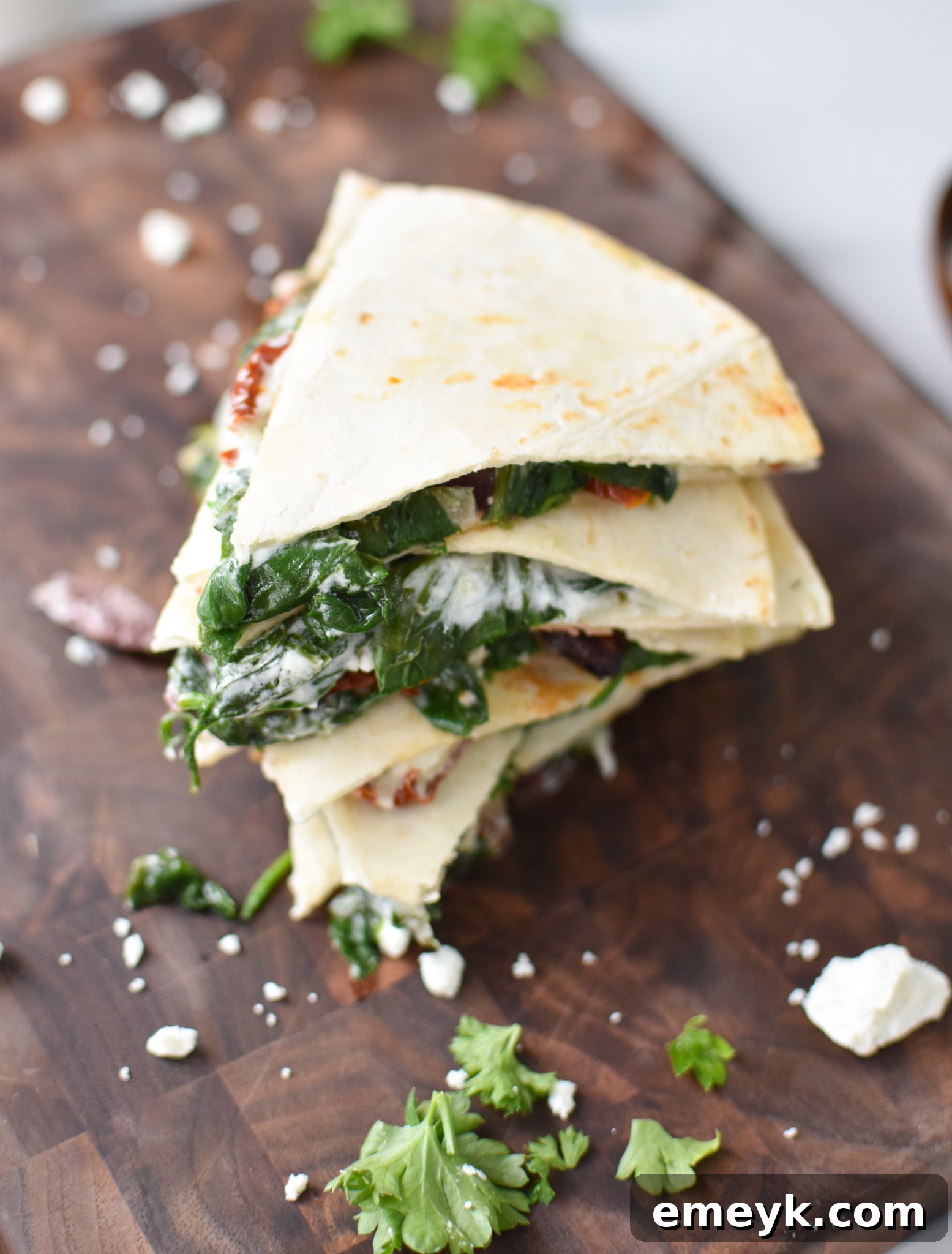 Simple Veggie Quesadillas 6 Sliced Easy Vegetarian Quesadilla Recipe on a wooden cutting board, showcasing the delicious fillings.
