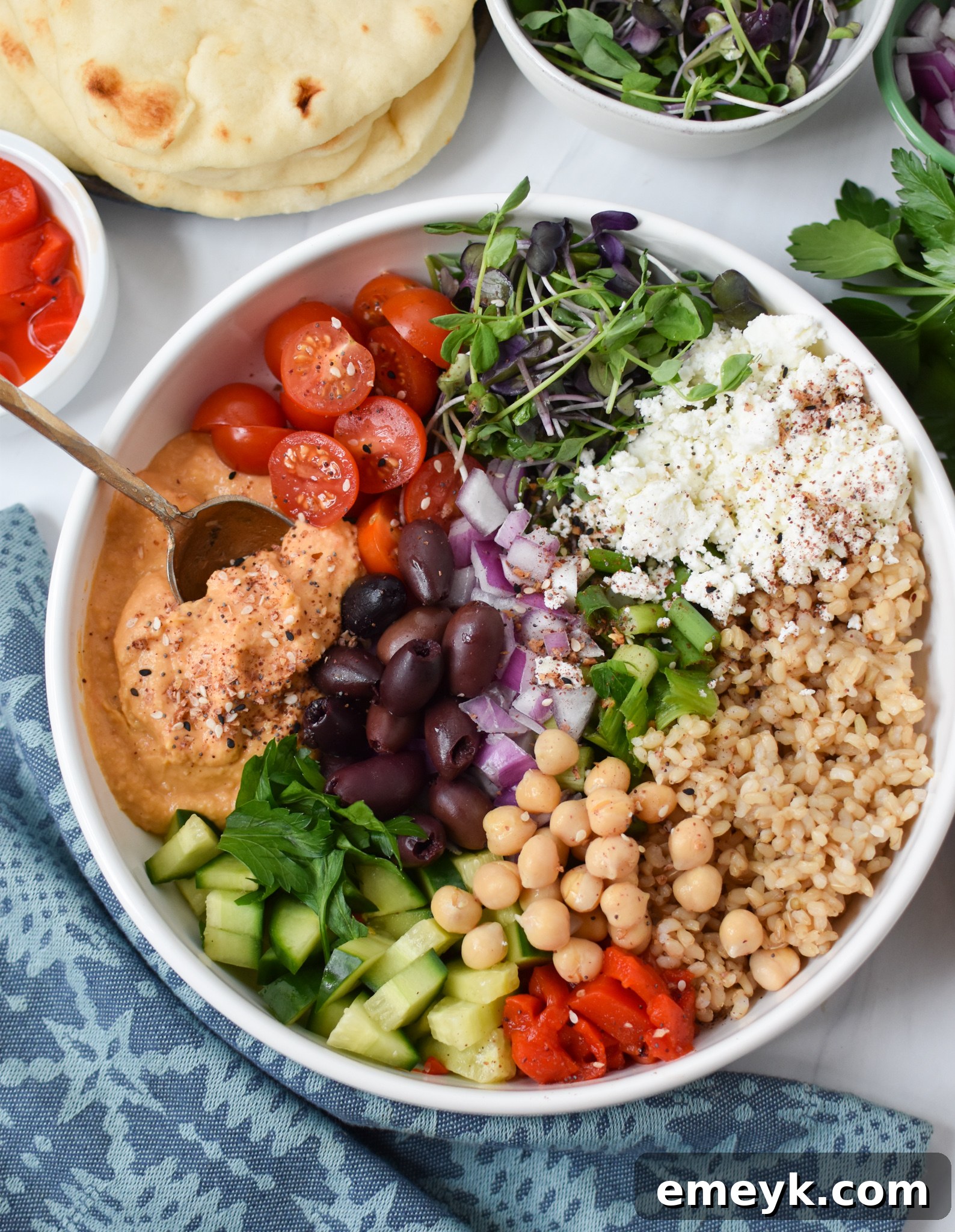 Vibrant Mediterranean Hummus Bowl 4 Easy Mediterranean Hummus Bowl with spoon.