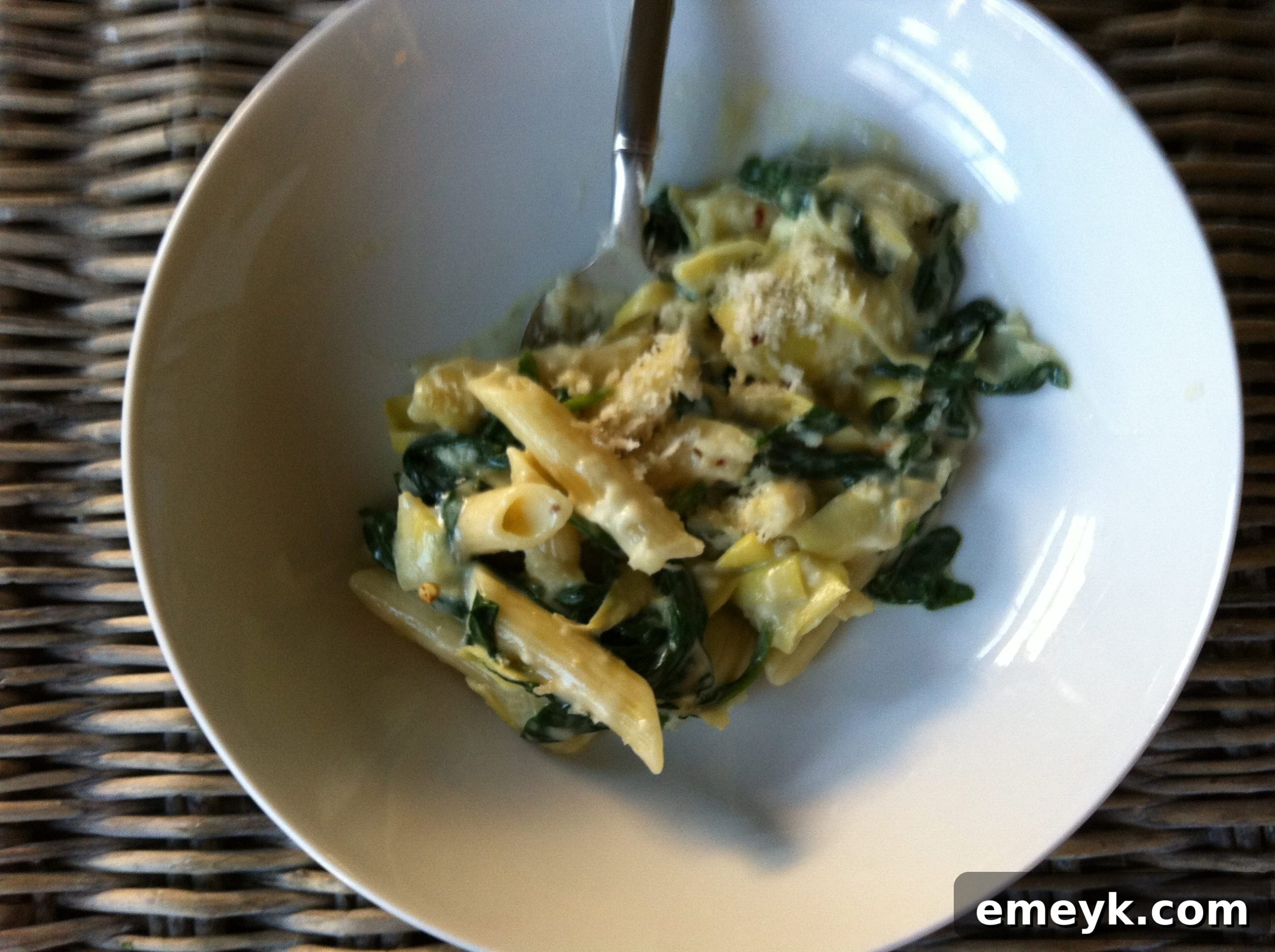 Creamy Spinach Artichoke Pasta with Panko Crunch 4 Spinach Artichoke Pasta ready to be served, topped with breadcrumbs