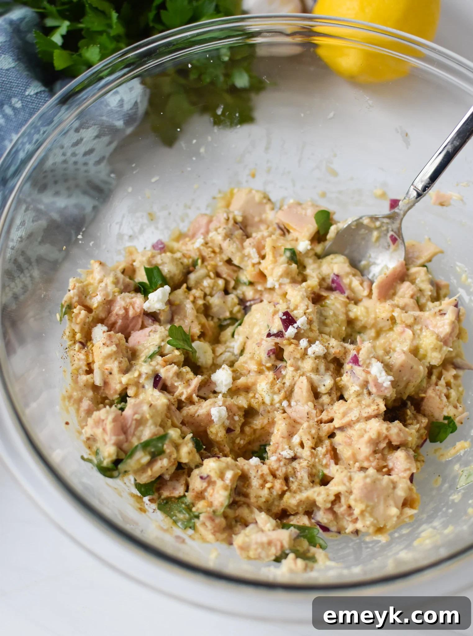 Sun Kissed Mediterranean Tuna Fritters 6 Mediterranean Tuna Patties recipe tuna mixture fully combined in a bowl.