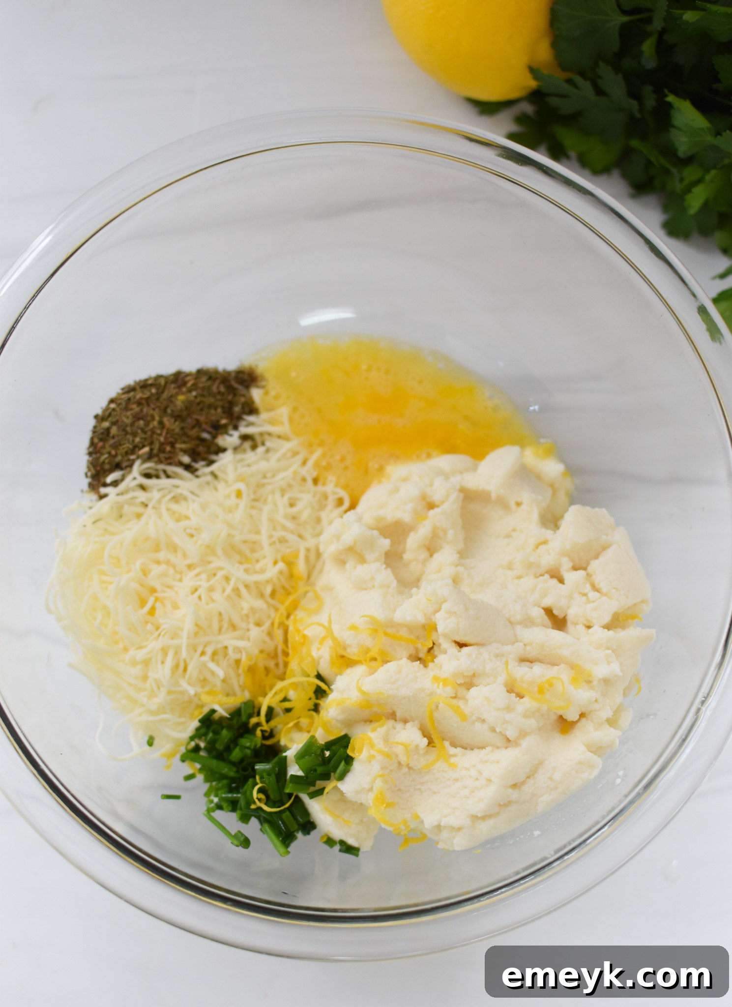 A large bowl of the creamy veal and cheese stuffing mixture, ready to be put into pasta shells.