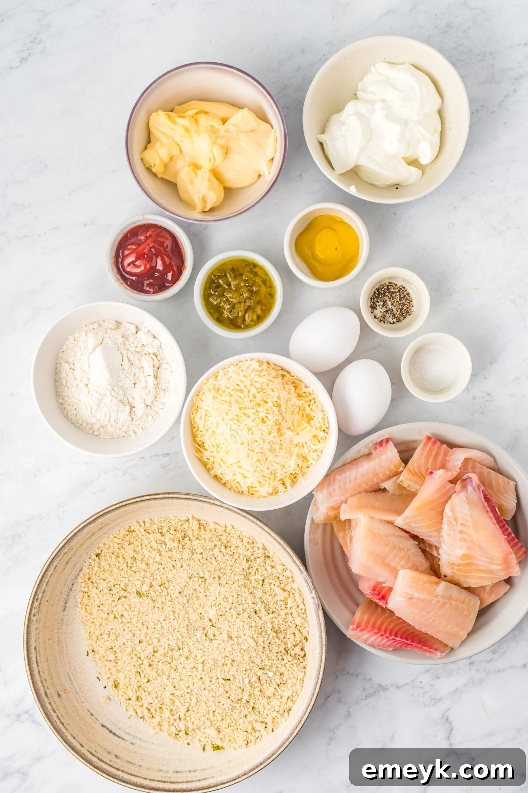 Ingredients for Baked Parmesan Fish Sticks laid out.