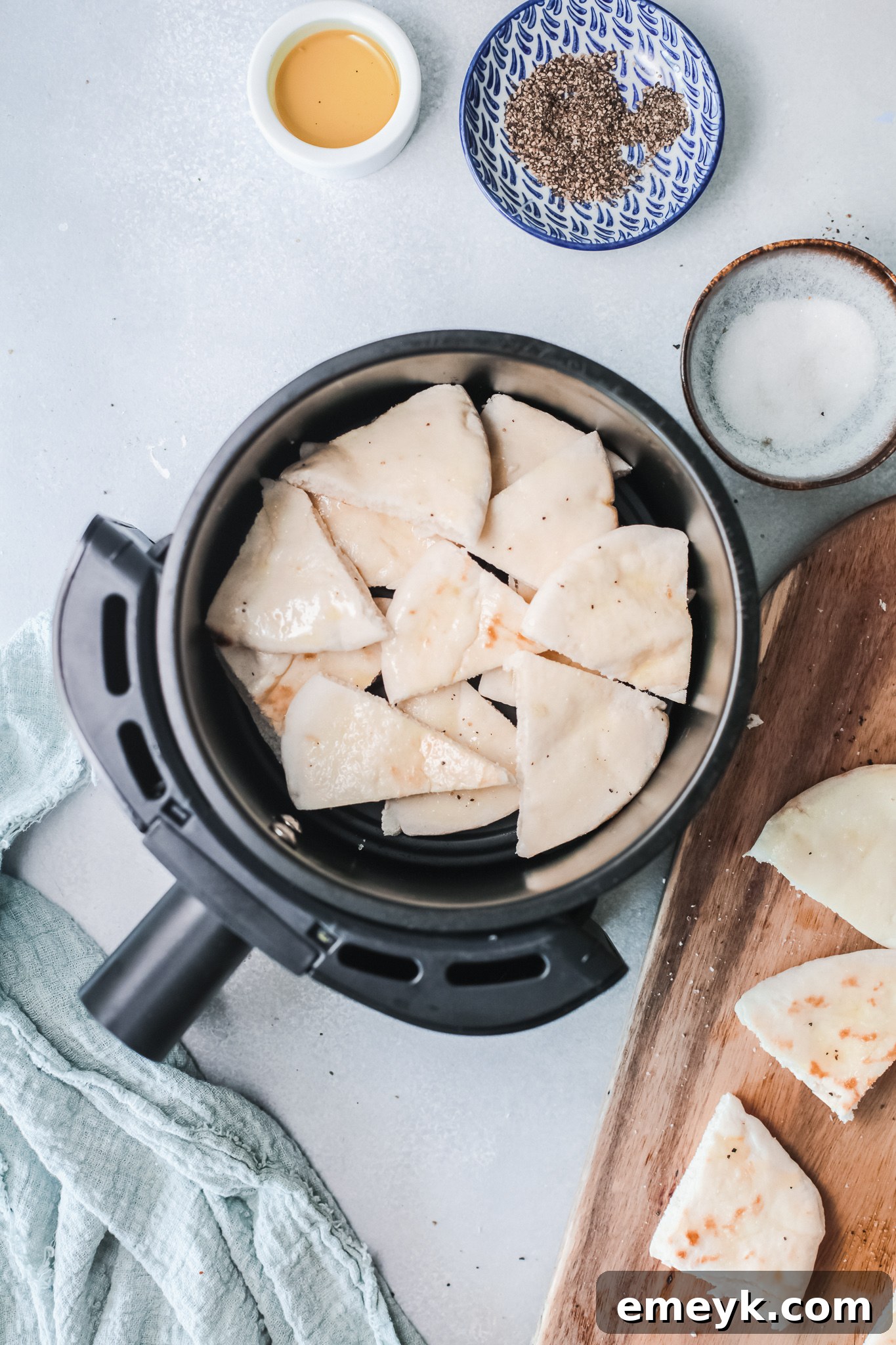 Seasoned pita chips ready to go into the air fryer.