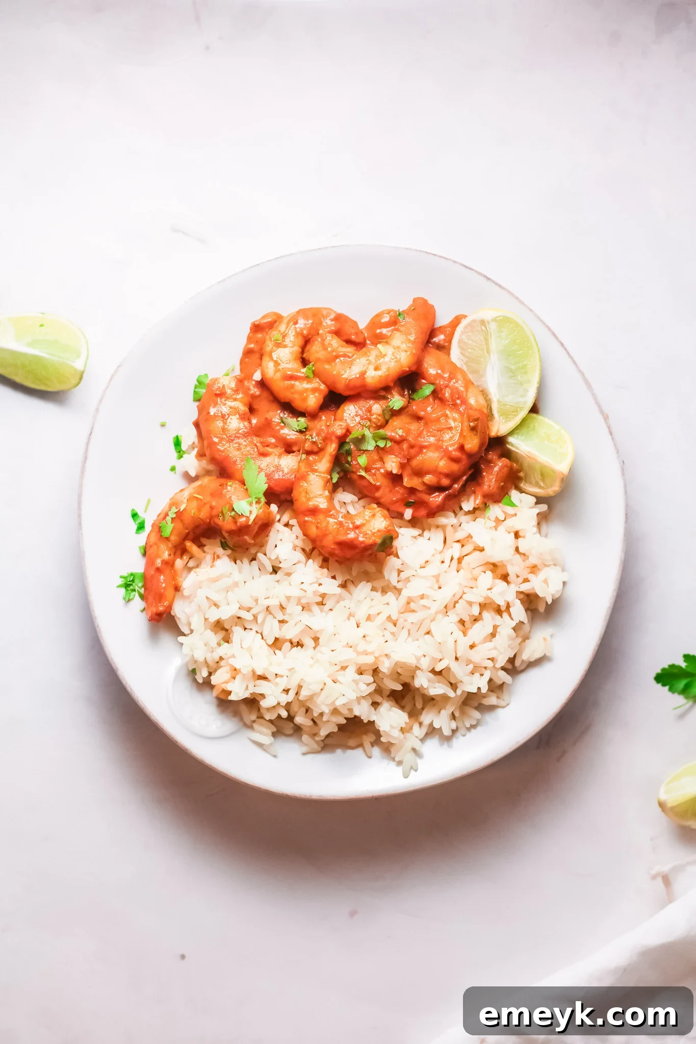 Weeknight Shrimp Curry 3 Easy Shrimp Curry Recipe served with rice and garnished with cilantro.