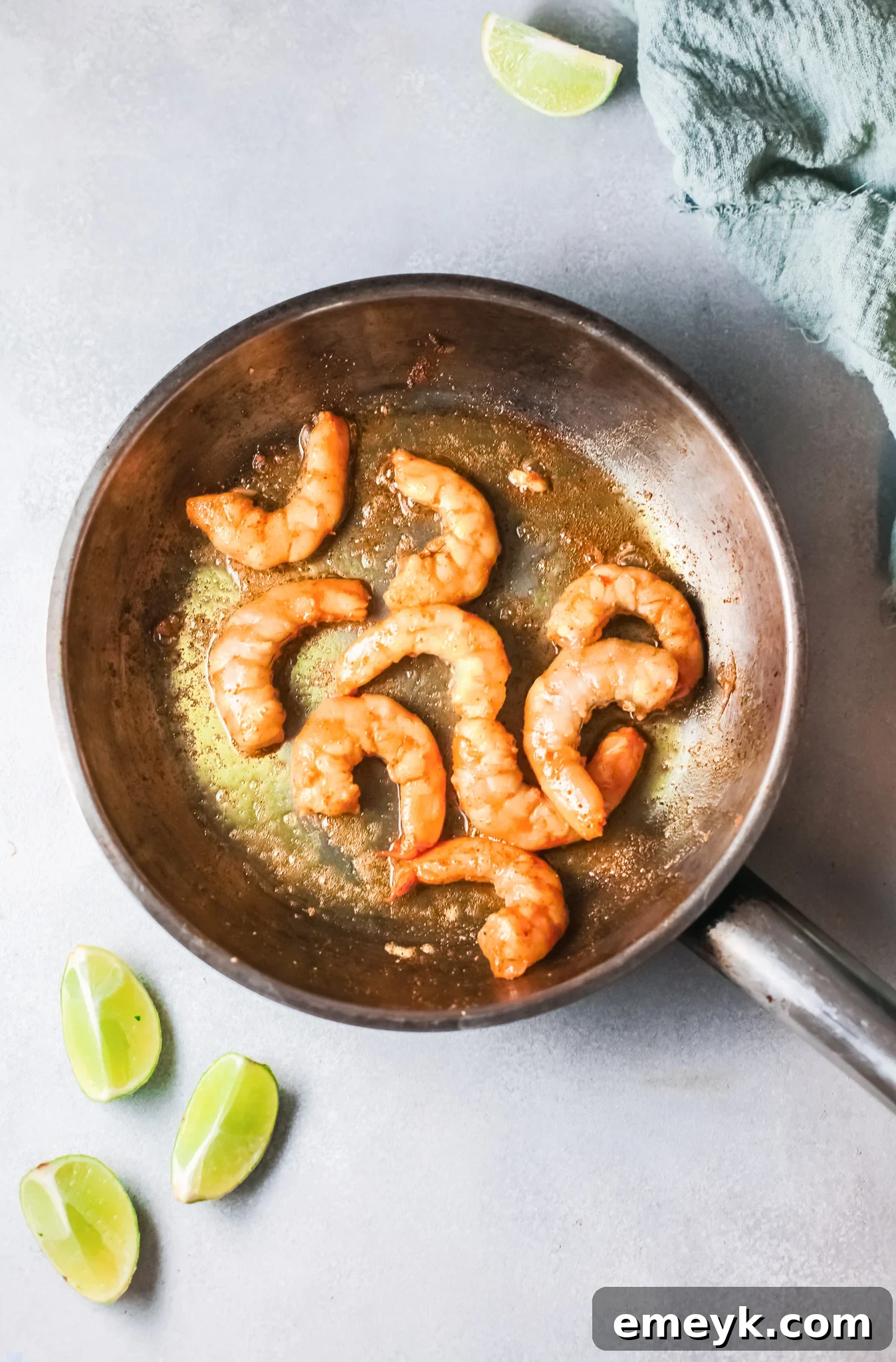 Weeknight Shrimp Curry 6 Shrimp in a skillet, partially cooked for Easy Shrimp Curry.
