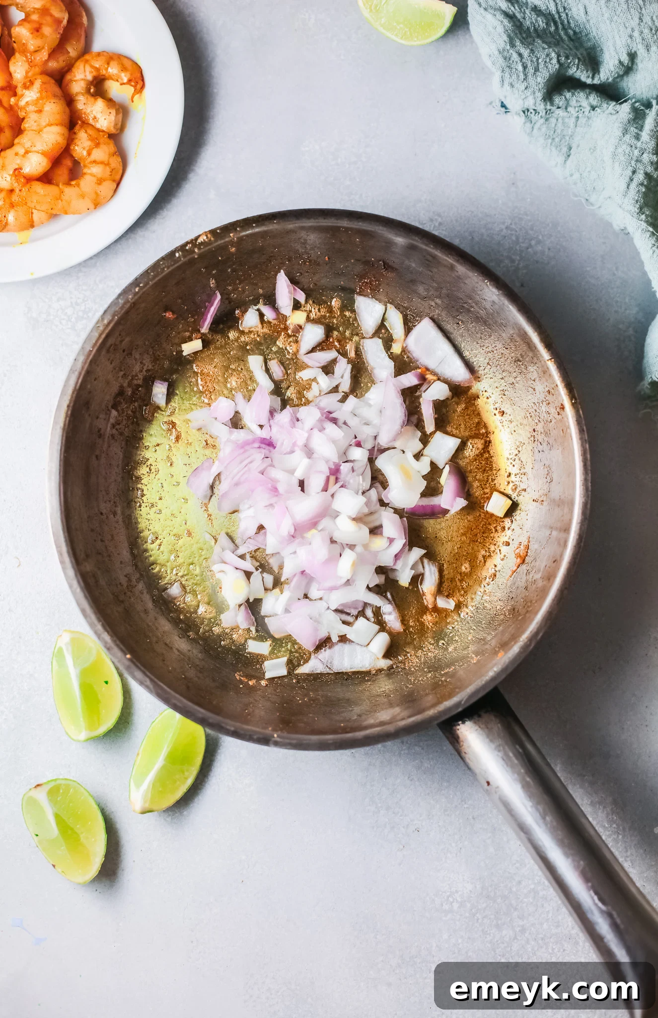 Weeknight Shrimp Curry 7 Onion sautéing in a skillet for Easy Shrimp Curry.
