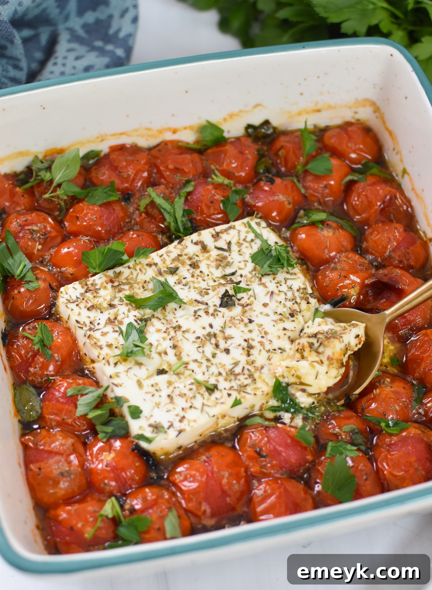Effortless Baked Feta Delight 4 Easy Baked Feta Recipe with golden serving spoon, showing creamy texture.