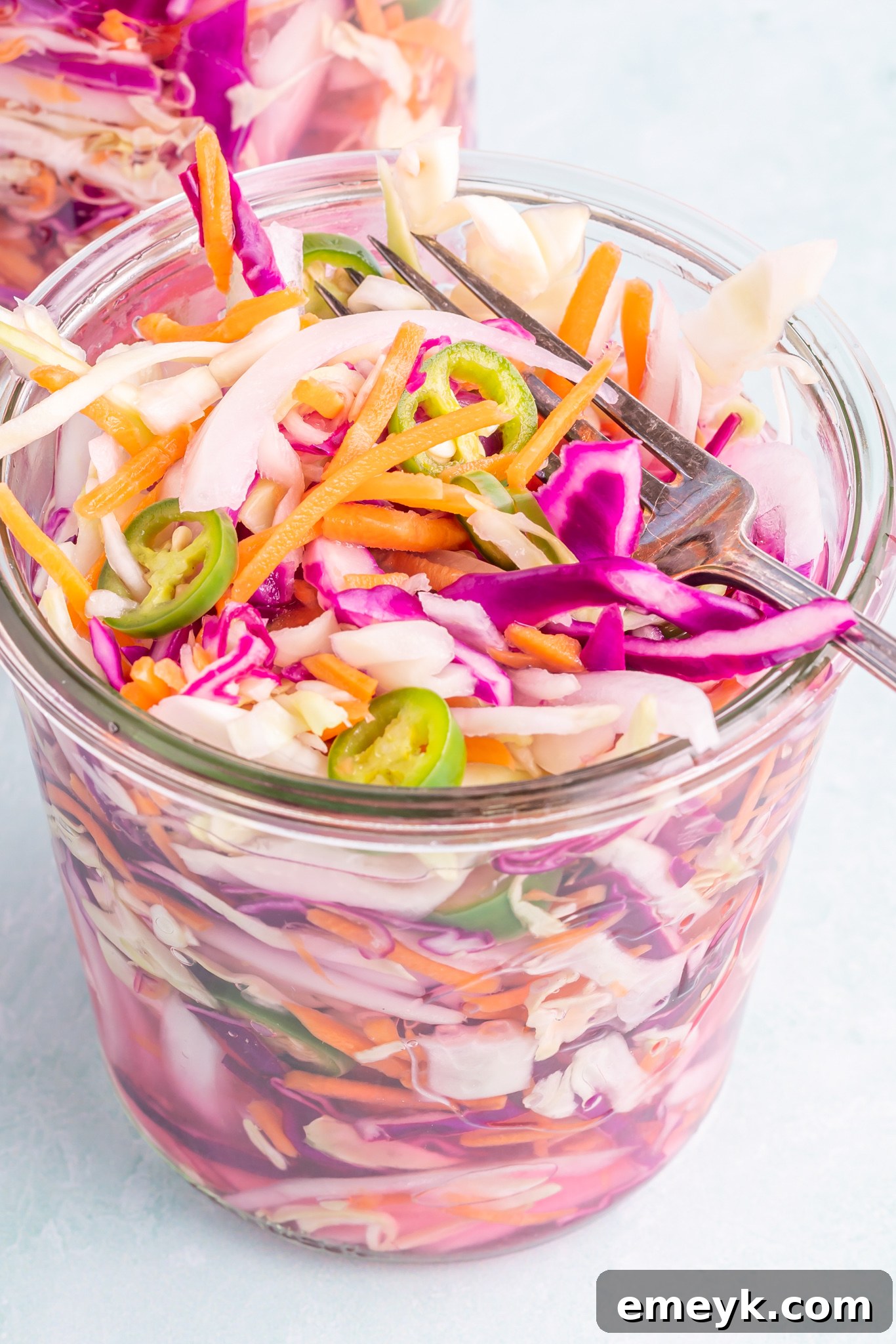 Easy Curtido Recipe beautifully presented in a glass jar, showcasing its vibrant and crisp vegetables.