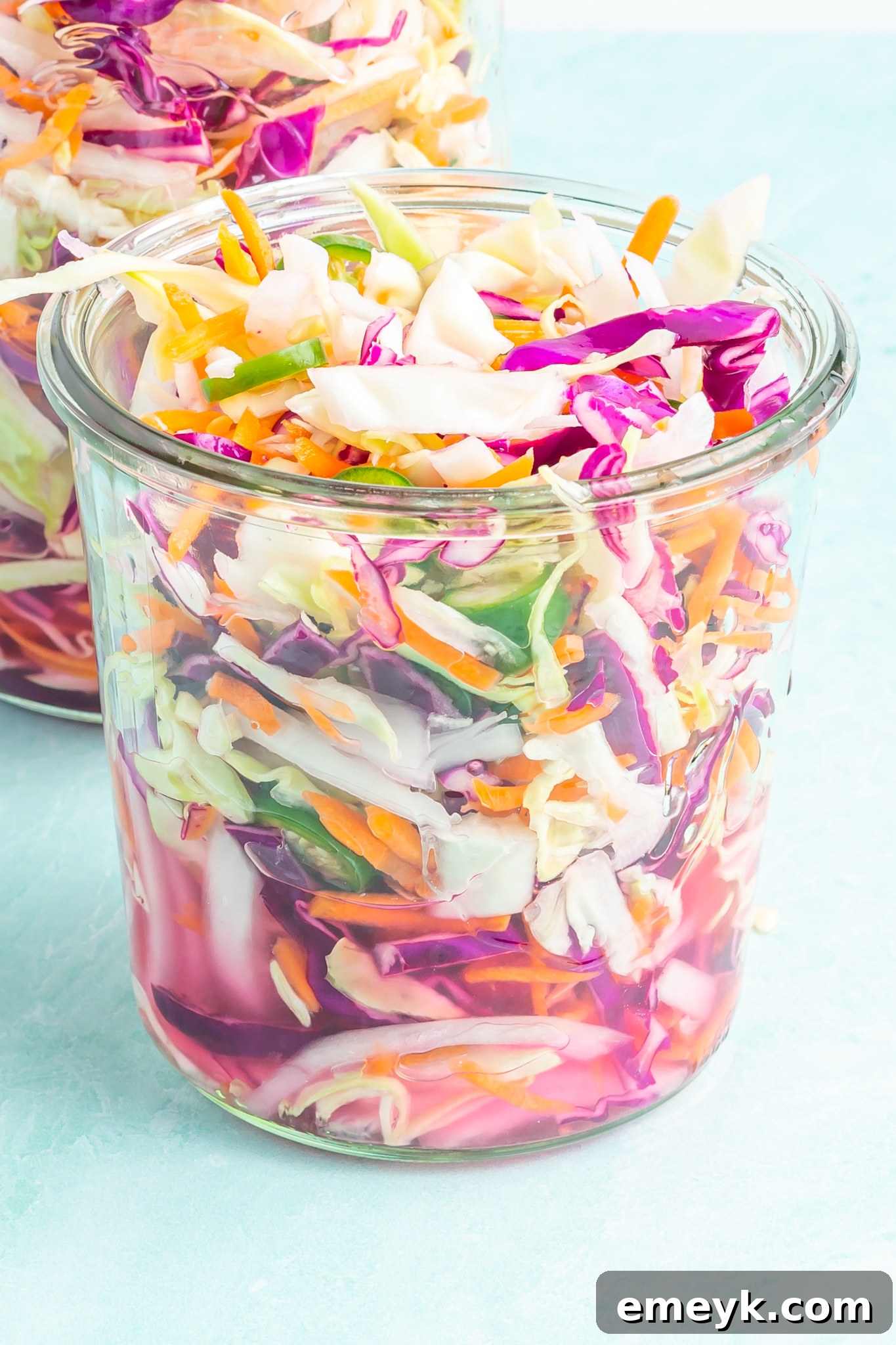 A beautifully prepared jar of Easy Curtido, showcasing its vibrant colors and crisp texture, ready to be served.