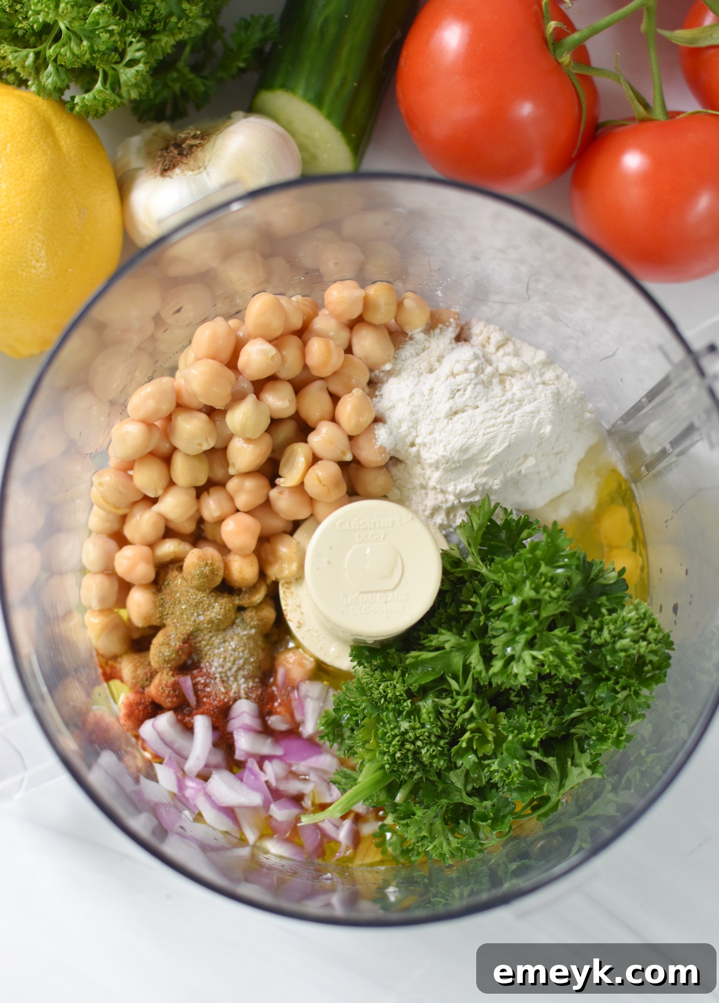 Golden Falafel Grids 5 All the Falafel Waffles ingredients are placed in a food processor, ready to be blended into a delicious mixture.