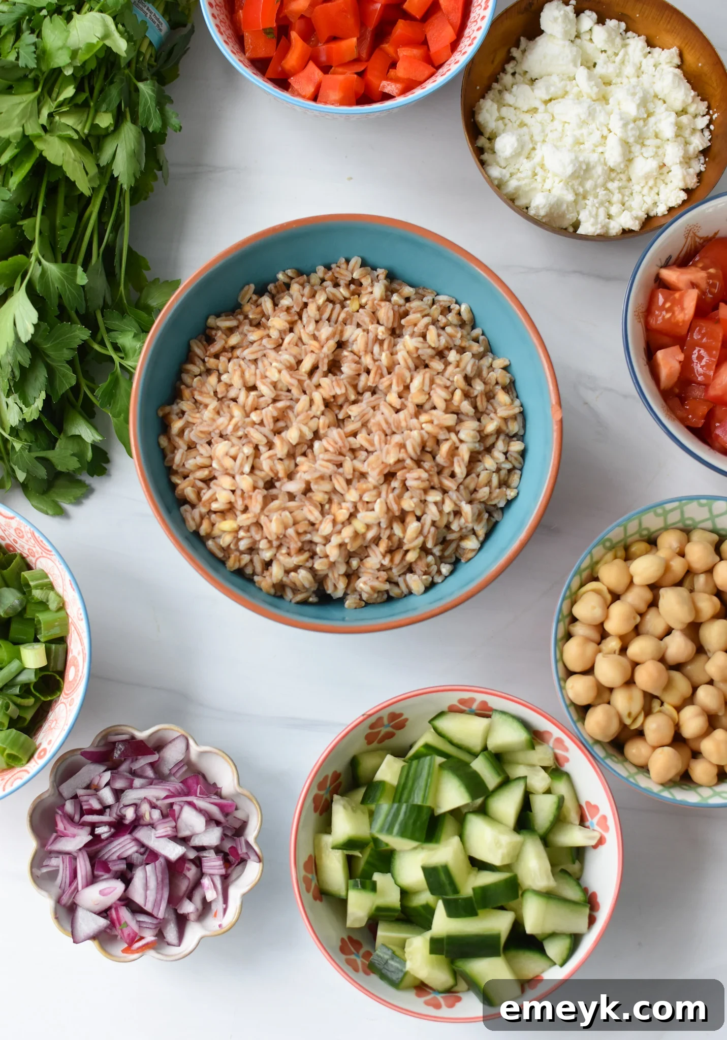 A colorful array of Mediterranean Farro Salad ingredients, prepped and ready to mix.