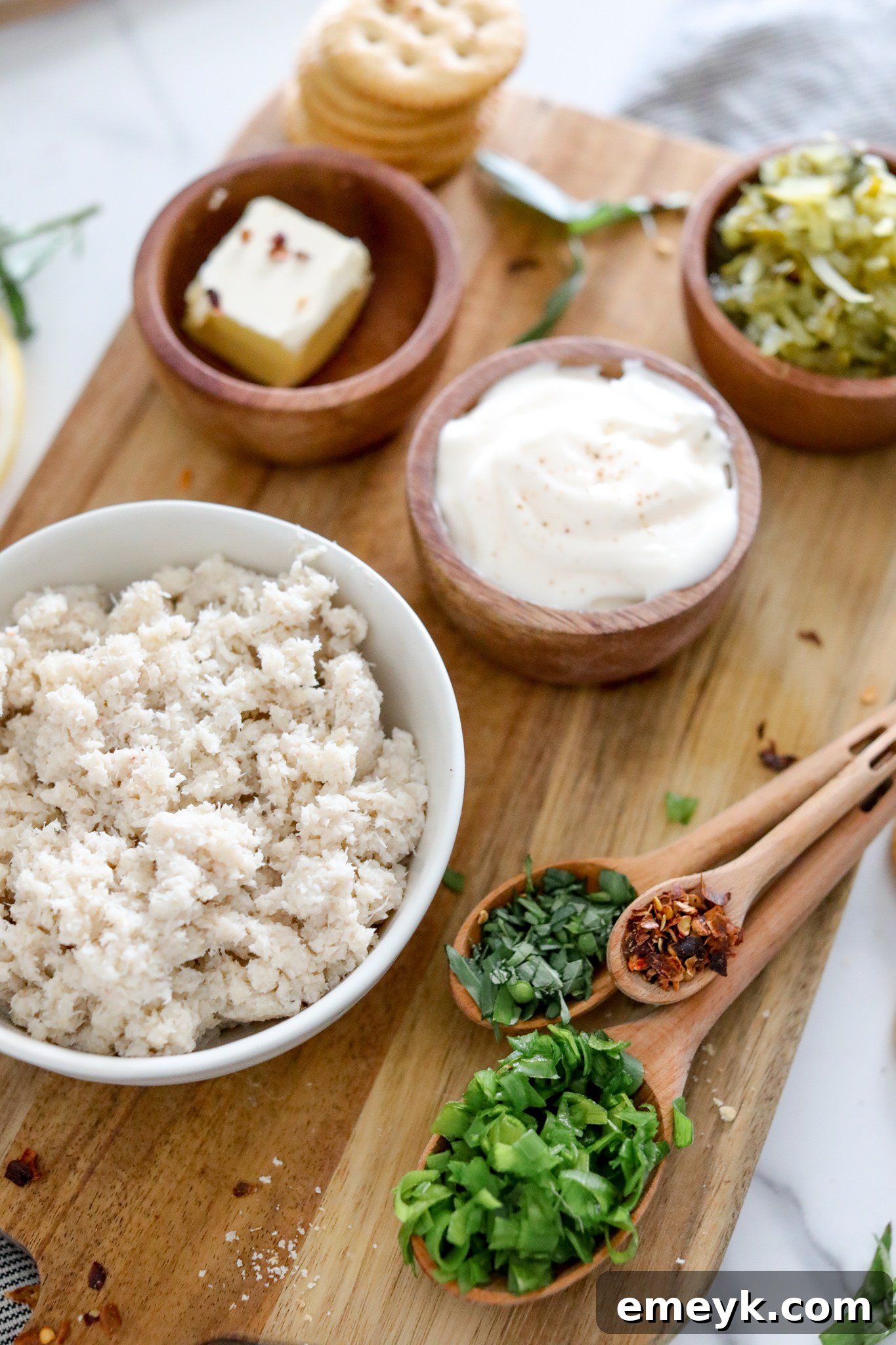 A bowl filled with fresh lump crab meat, ready to be mixed into the easy crab cake recipe.