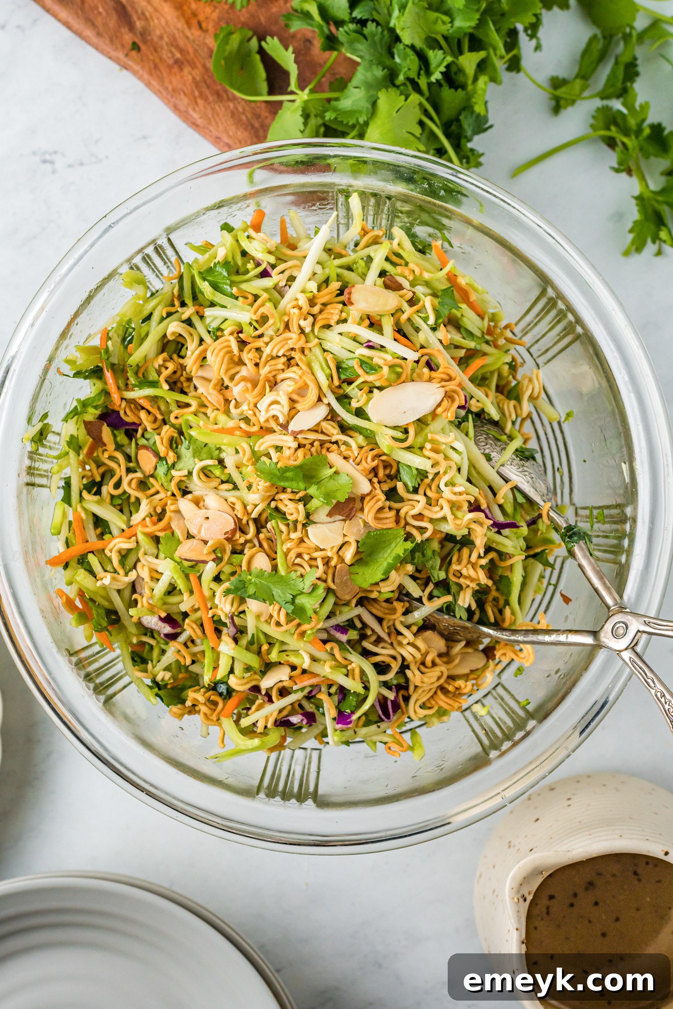 Broccoli Slaw Recipe in clear glass bowl.