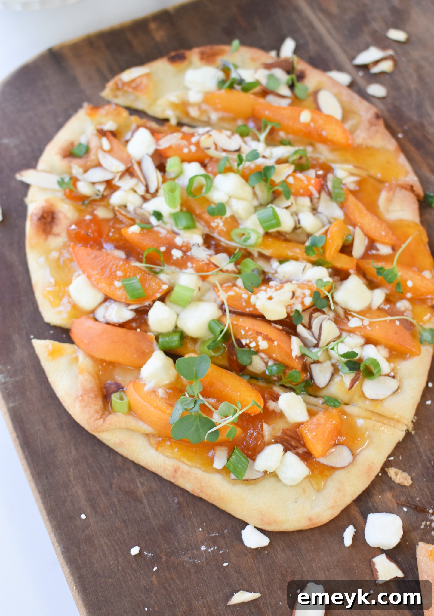 Golden Apricot & Chèvre Pizza 6 Individual slices of Goat Cheese Apricot Pizza displayed, highlighting the colorful toppings.