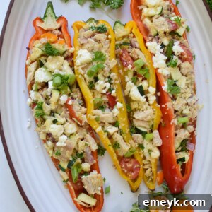 Mediterranean Tuna Couscous Stuffed Peppers on a white platter.