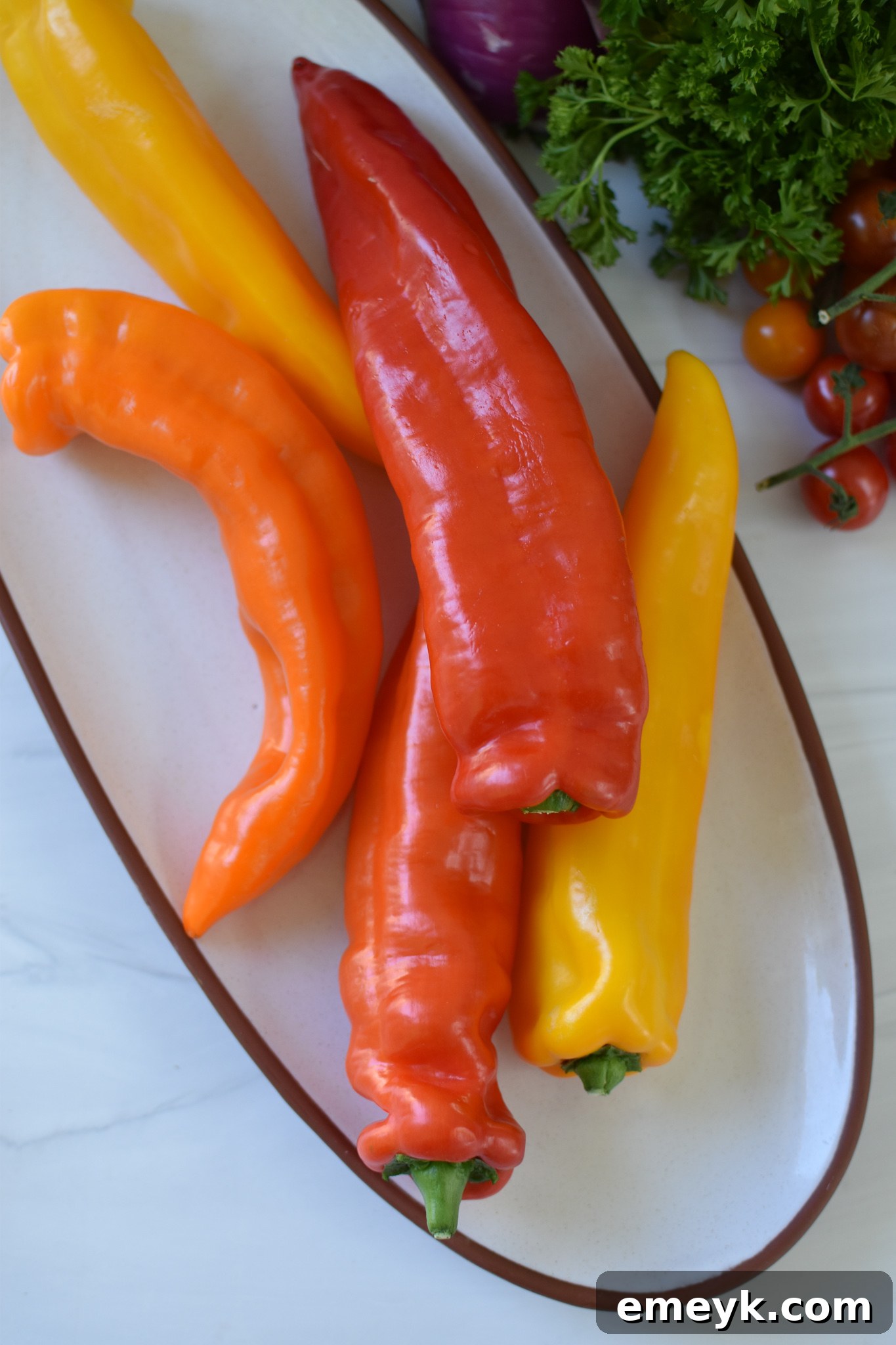 Sweet peppers, halved and deseeded, ready for stuffing.