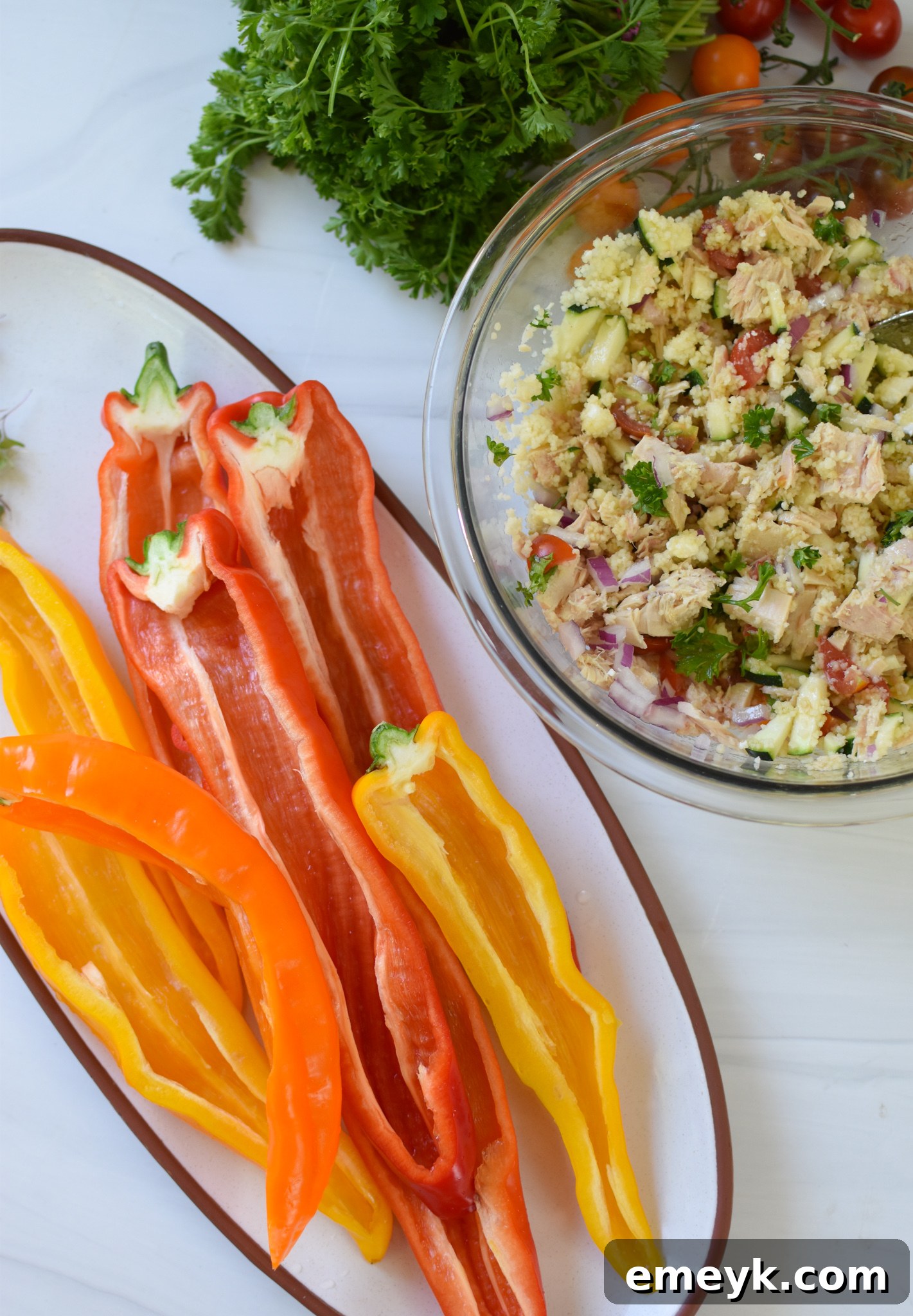 Mediterranean Tuna Couscous Stuffed Peppers, peppers cut in half and stuffed.