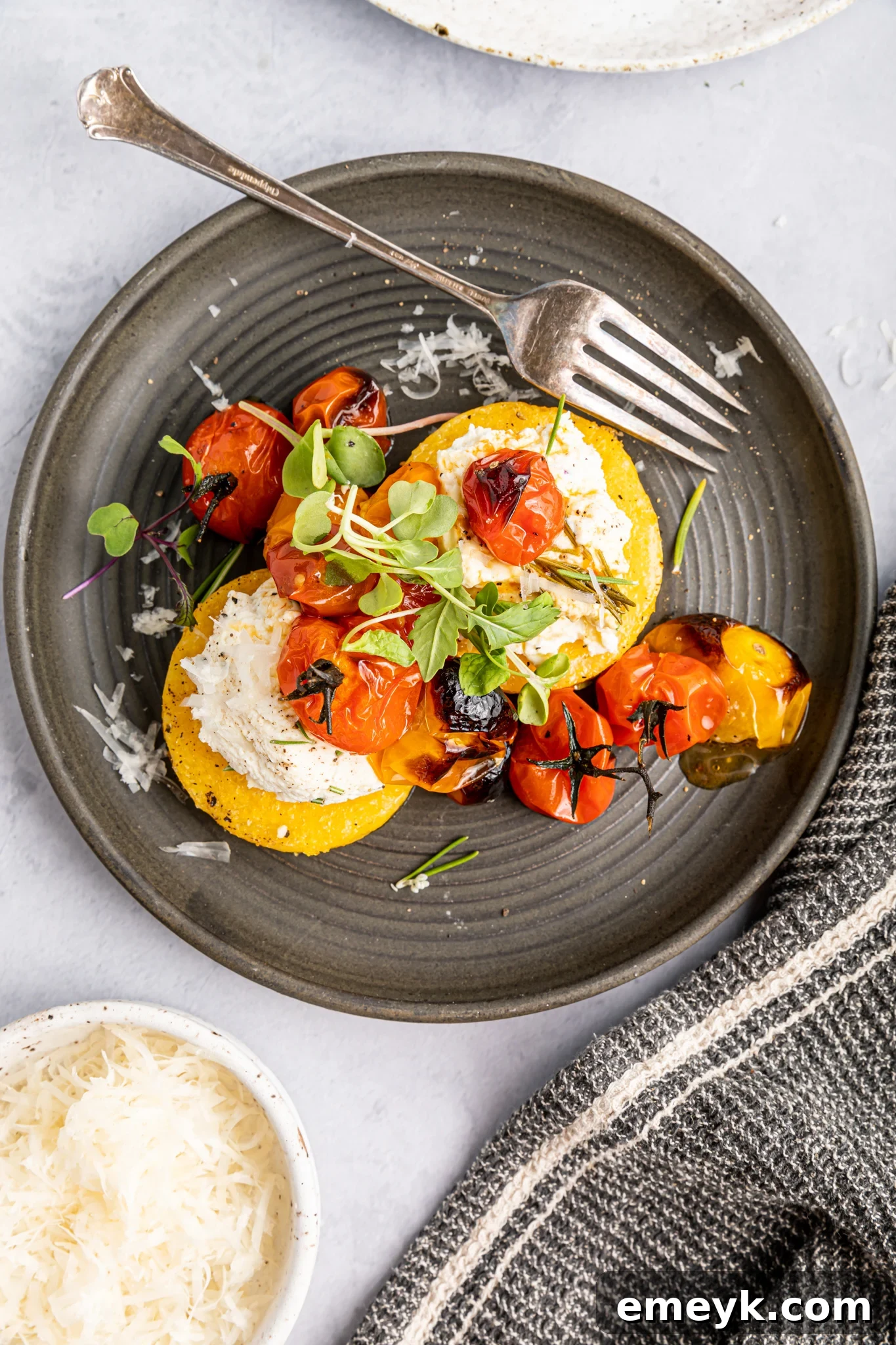 Crispy Polenta Stacks served on a plate with a fork, ready to be enjoyed.