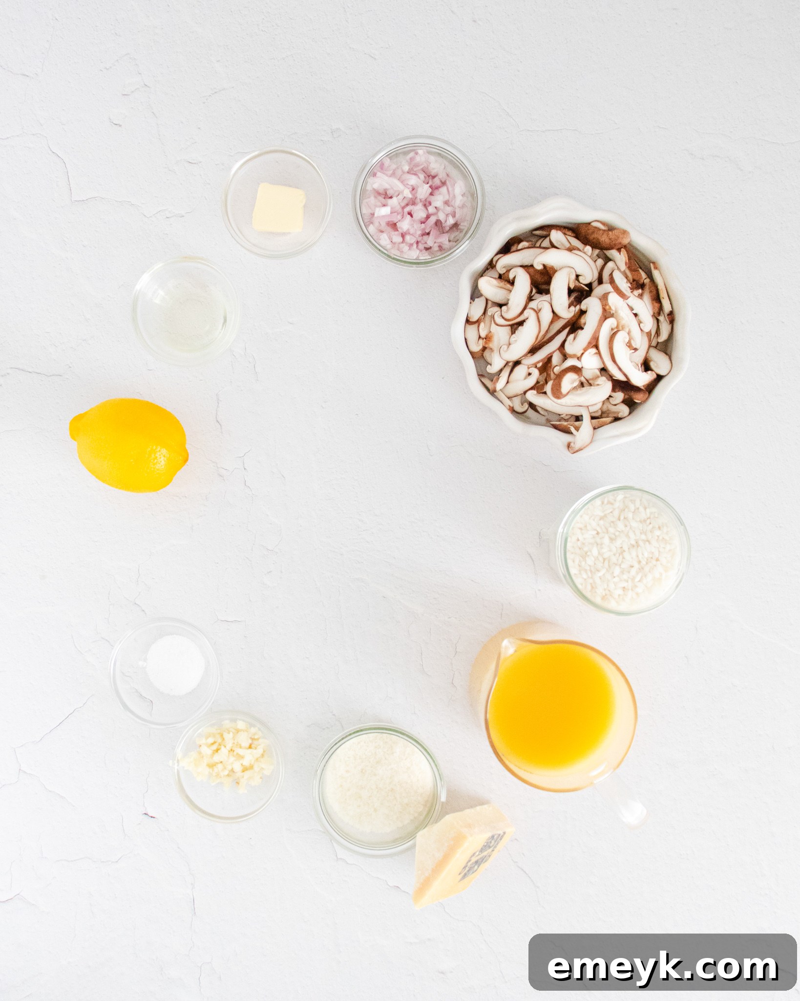 Fresh ingredients for Instant Pot Mushroom Risotto laid out on a cutting board.