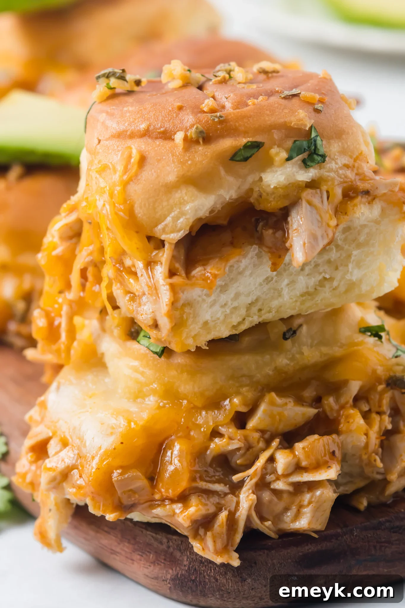 Delicious Chicken Enchilada Sliders oozing with melted cheese and ready to serve.