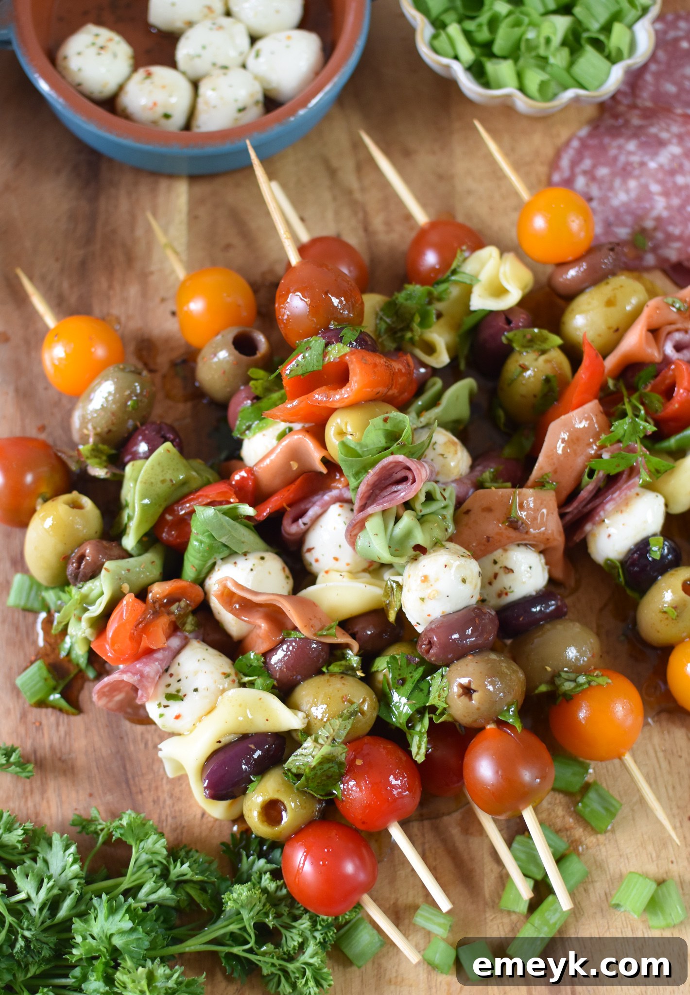 Antipasto Picks 3 Antipasto Skewers neatly arranged on a rustic cutting board, ready to be served.