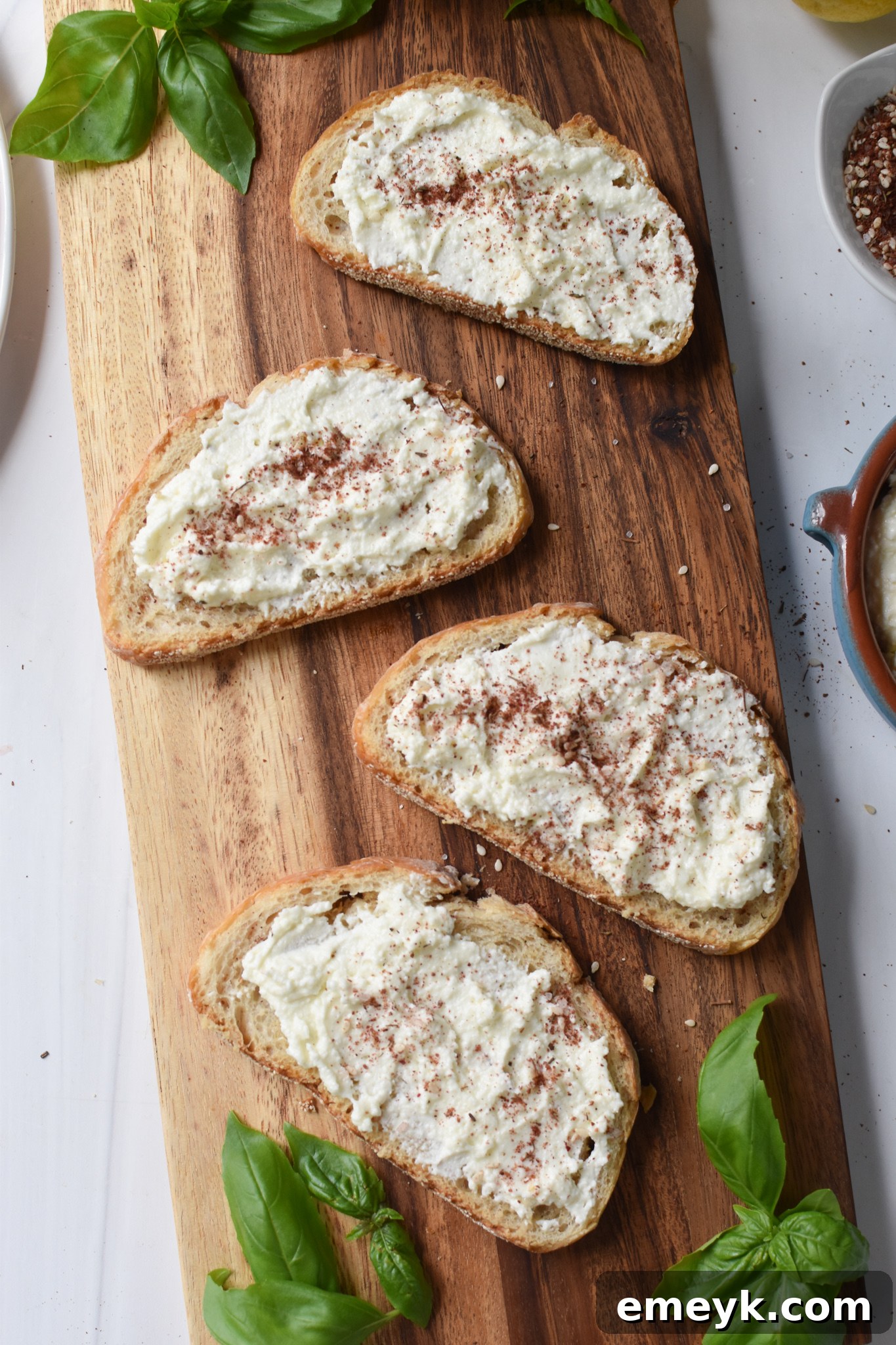 Tomato Toast with Whipped Feta whipped feta on bread.
