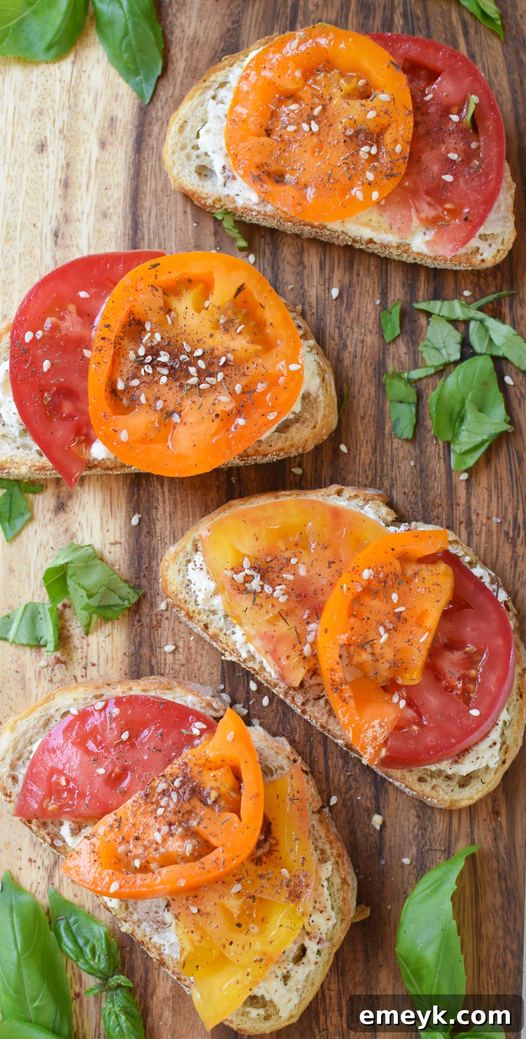 Tomato Toast with Whipped Feta toast on a cutting board.