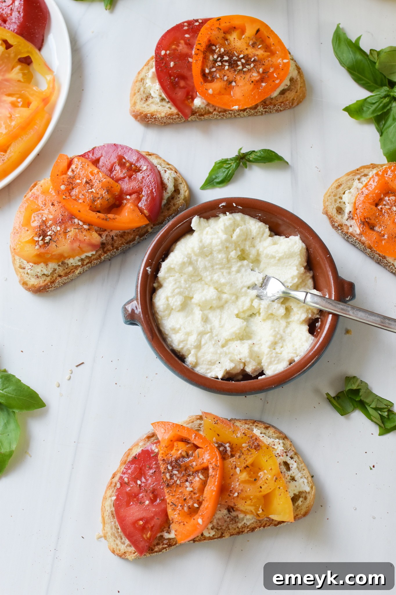 Tomato Toast with Whipped Feta with feta in the middle.