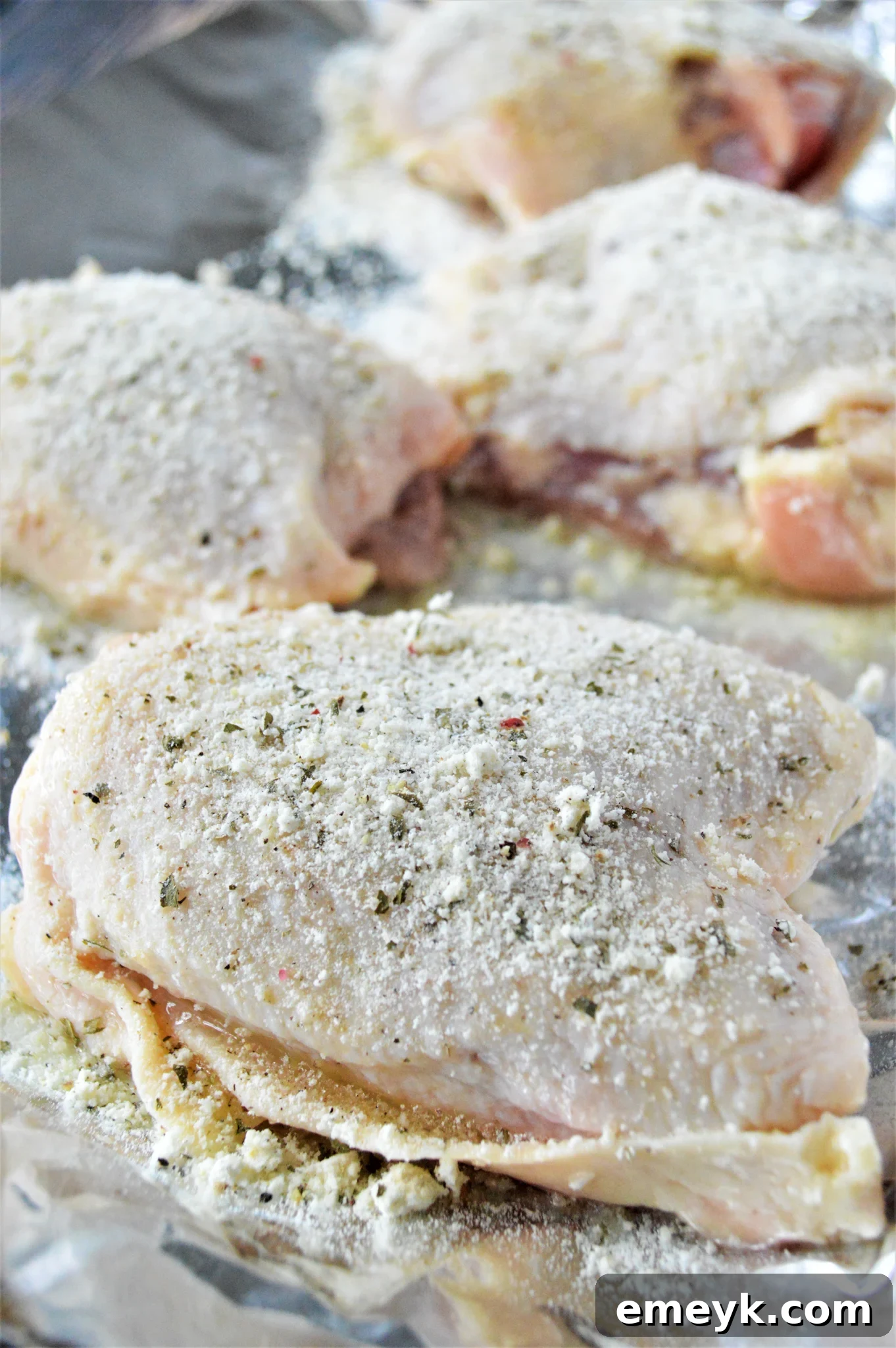 Creamy Ranch Chicken Thighs 6 Oven Baked Ranch Chicken Thighs chicken with ranch seasoning, ready for the oven.