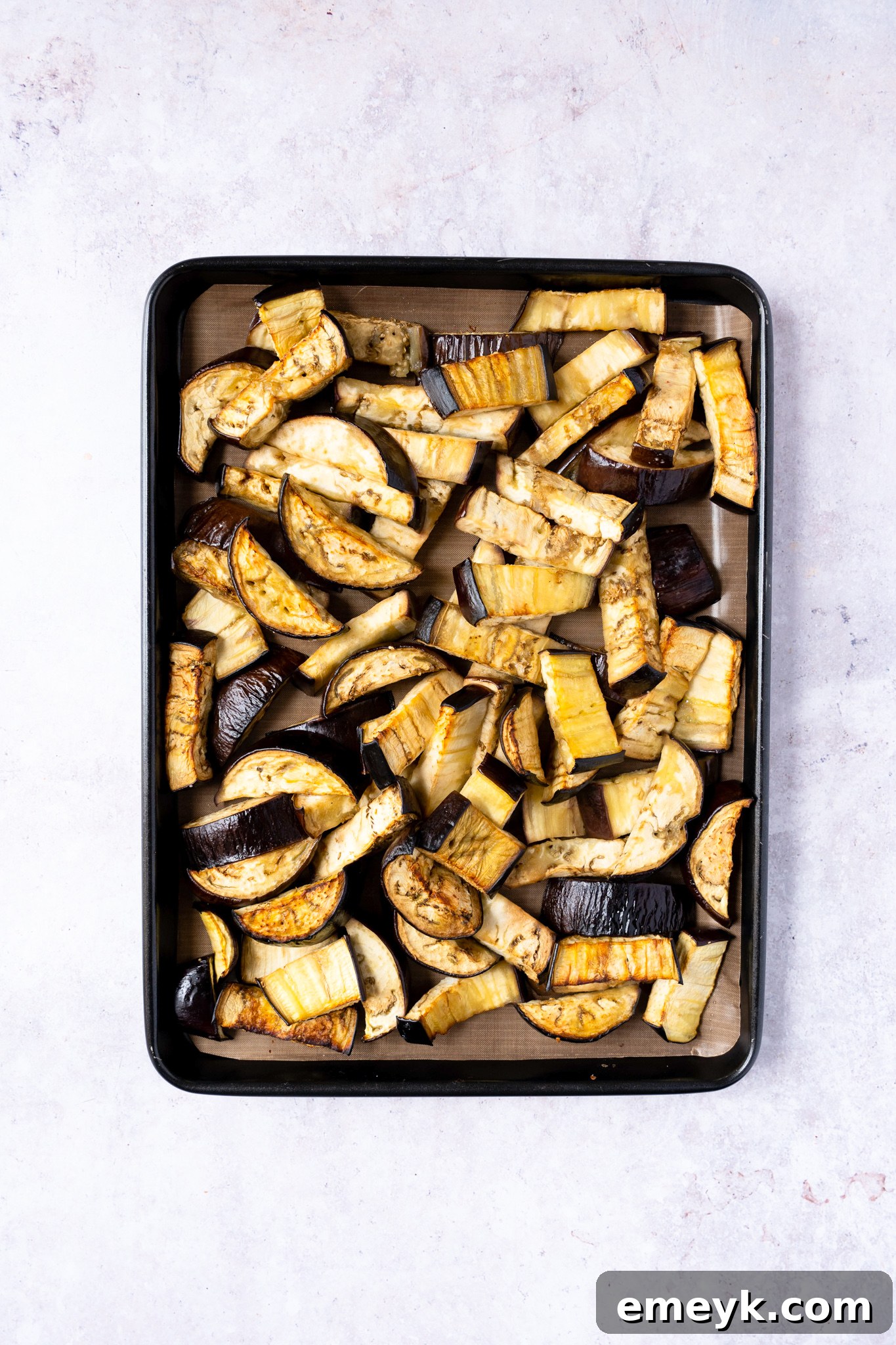 Weeknight Eggplant Wonder 6 Sautéing onions, garlic, and whole spices in a large pan as the base for the Easy Eggplant Curry sauce.
