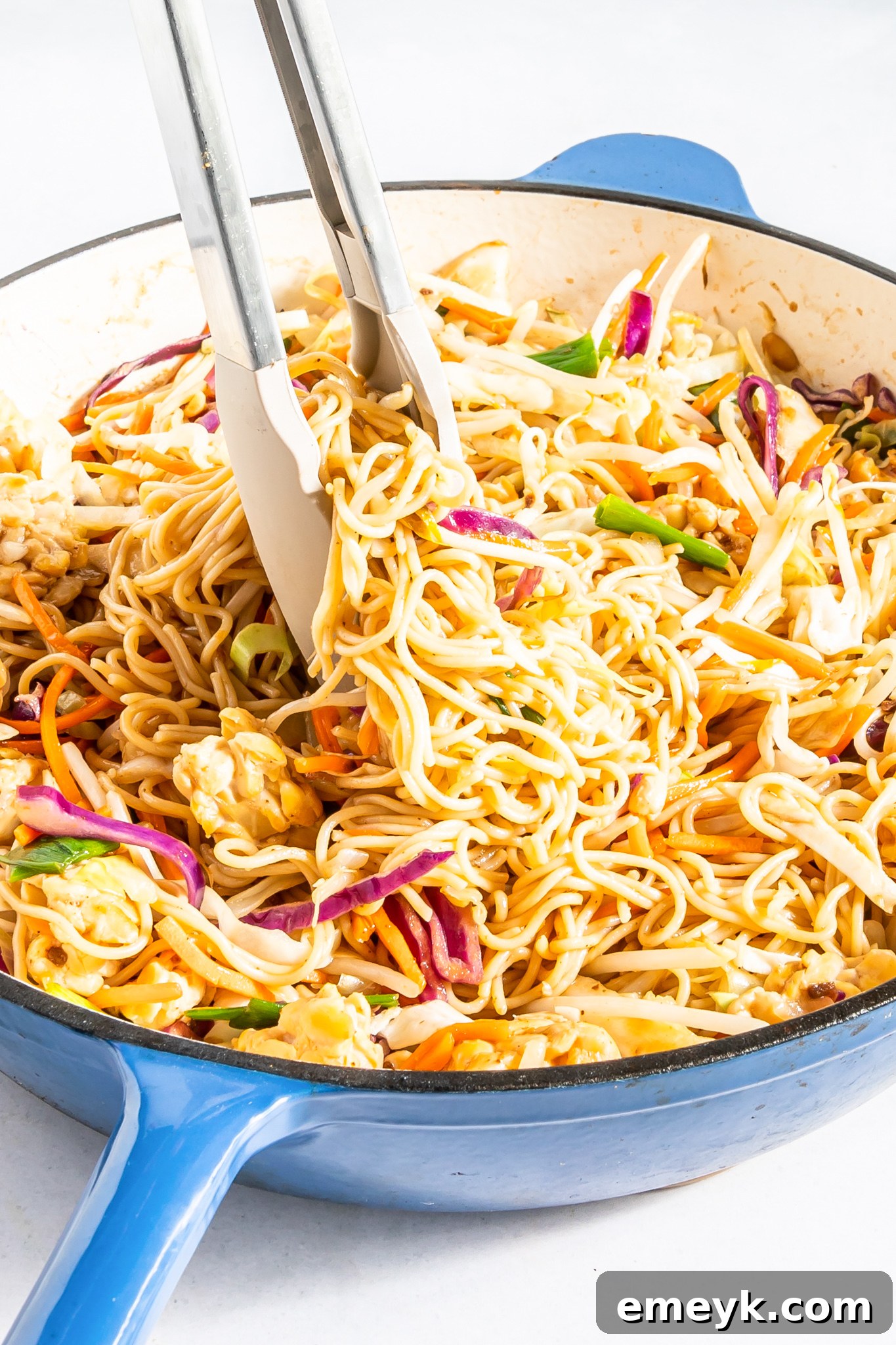 Wholesome Weeknight Veggie Chow Mein 2 Easy Vegetable Chow Mein in a large serving bowl, garnished with fresh cilantro and sesame seeds.