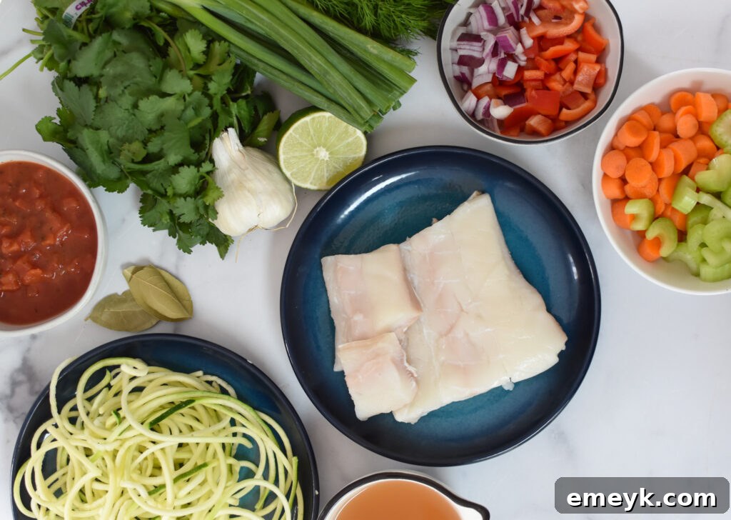 Mediterranean Fisherman's Soup 3 A vibrant display of fresh vegetables, herbs, and fish, laid out as ingredients for Mediterranean Fish Soup.