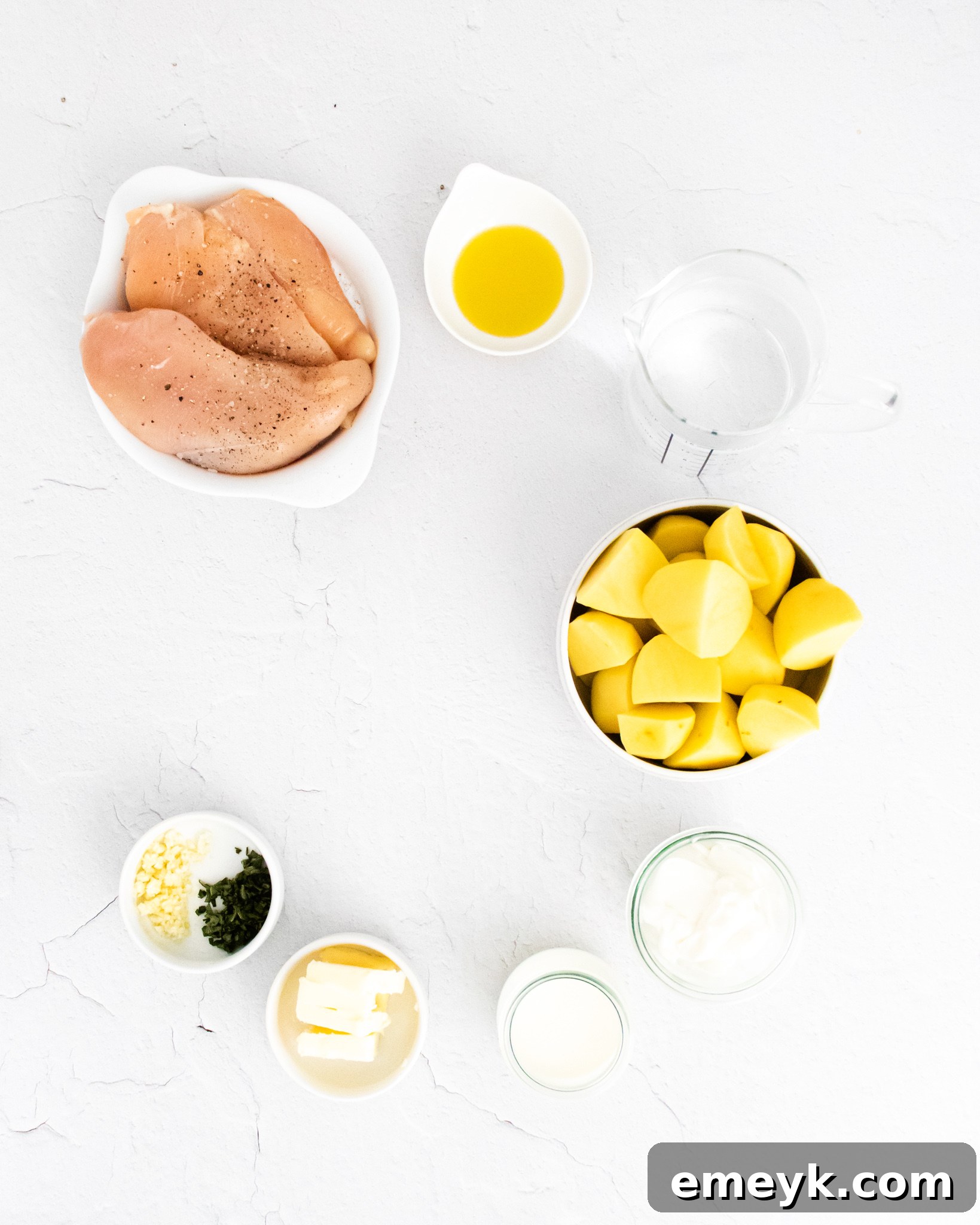 Ingredients for Instant Pot Chicken Breast Recipe laid out on a wooden surface.
