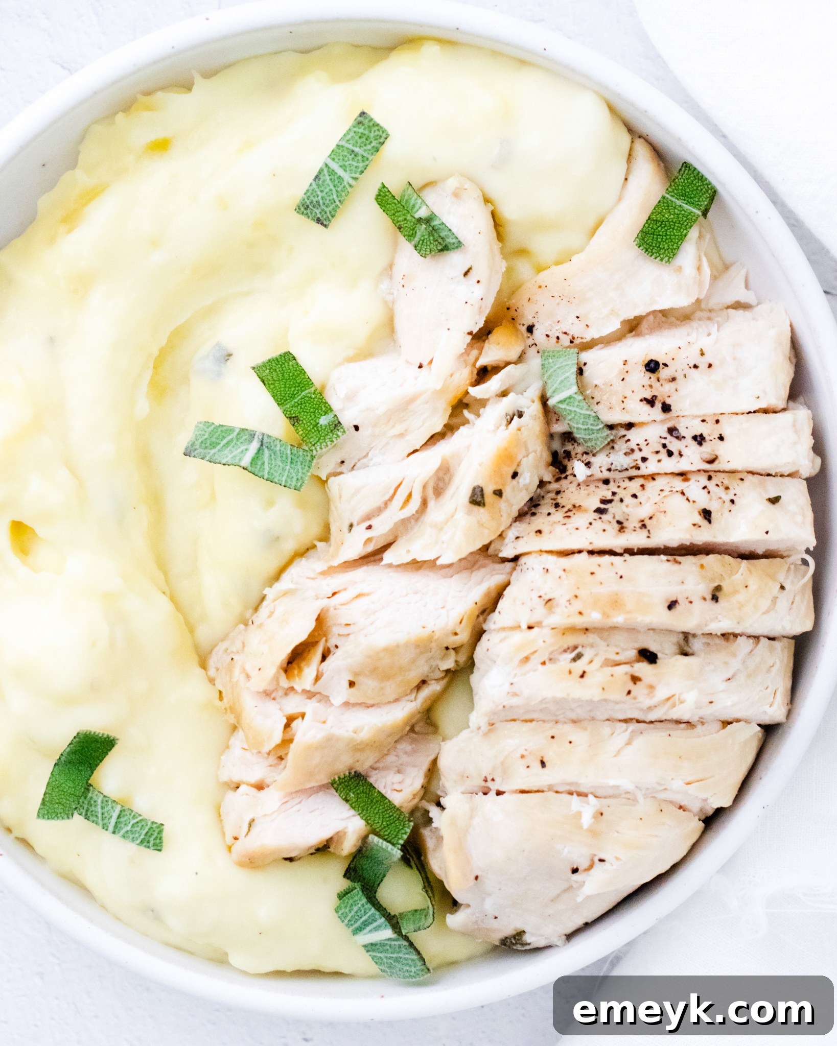 Instant Pot Chicken Breast Recipe with fresh sage garnish.