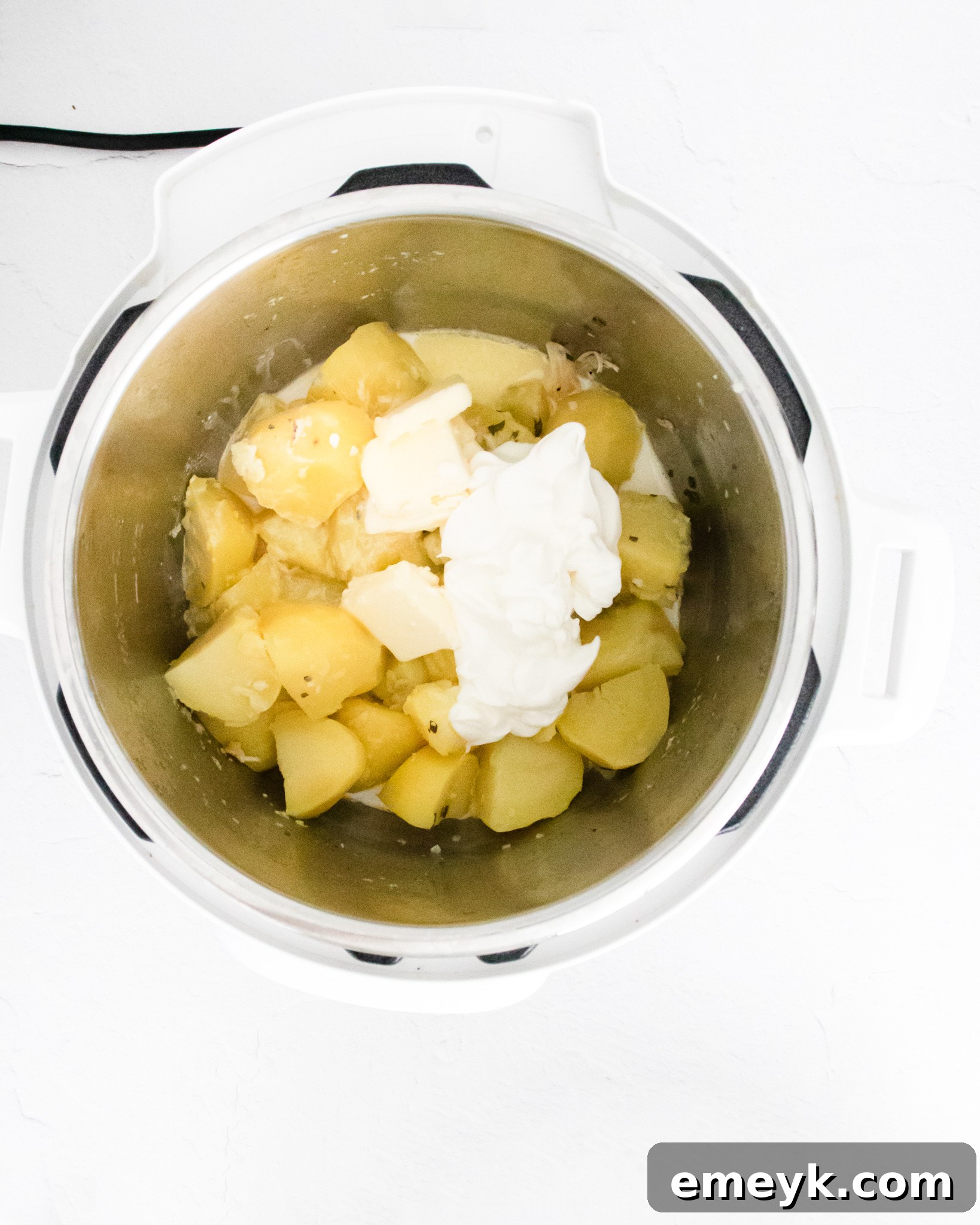 Instant Pot with steam releasing after cooking Chicken Breast and Potatoes.