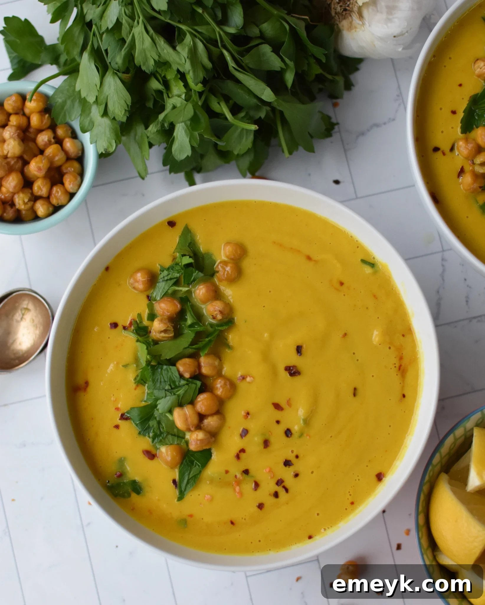 Velvety Cauliflower Dream 7 Creamy Cauliflower Soup with spoons.