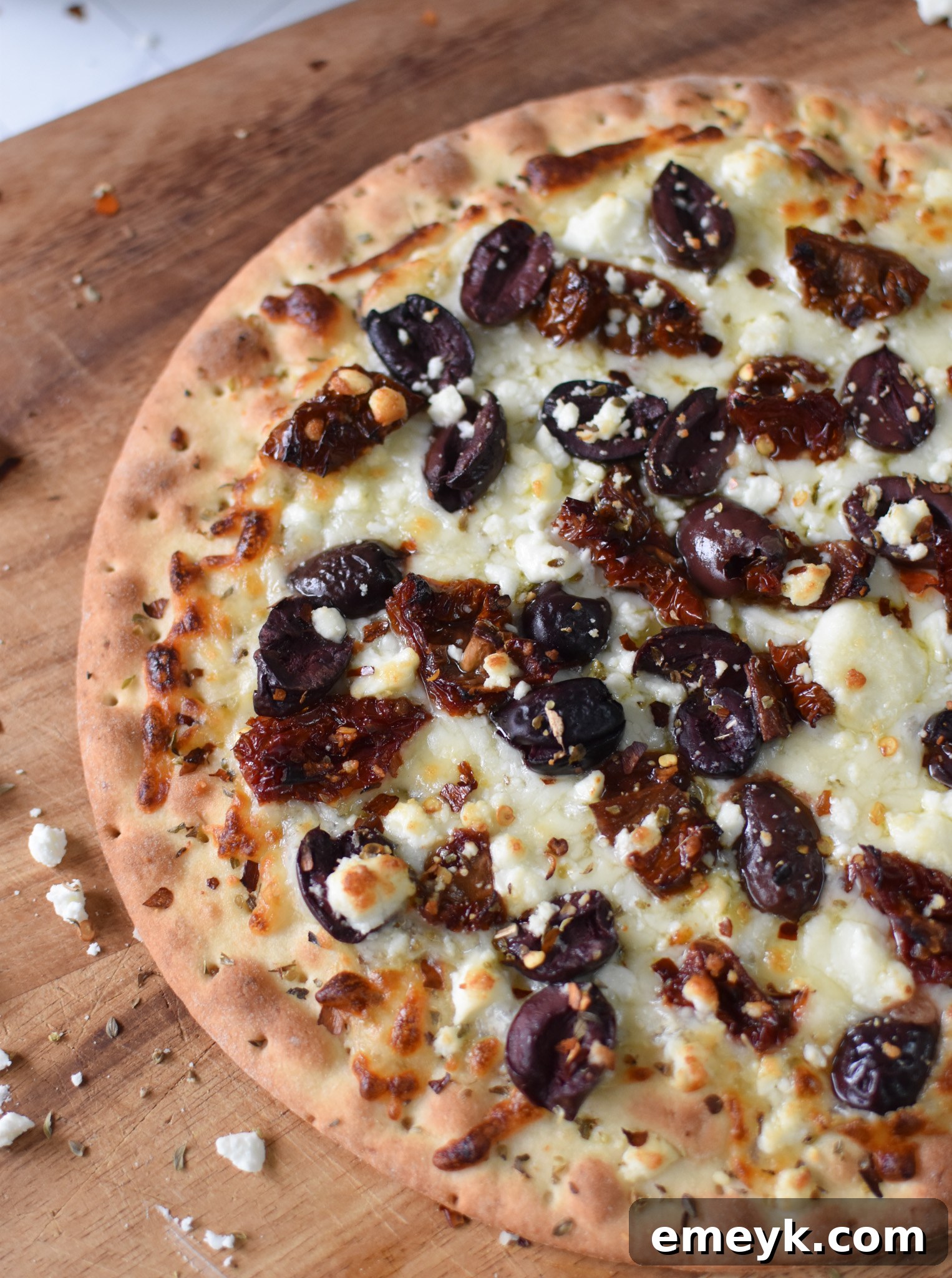 Hellenic Pizza 6 A baked Greek Pizza, golden and bubbly, fresh out of the oven.
