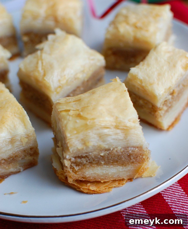 Beautifully layered homemade Lebanese Baklava, golden brown and glistening with syrup