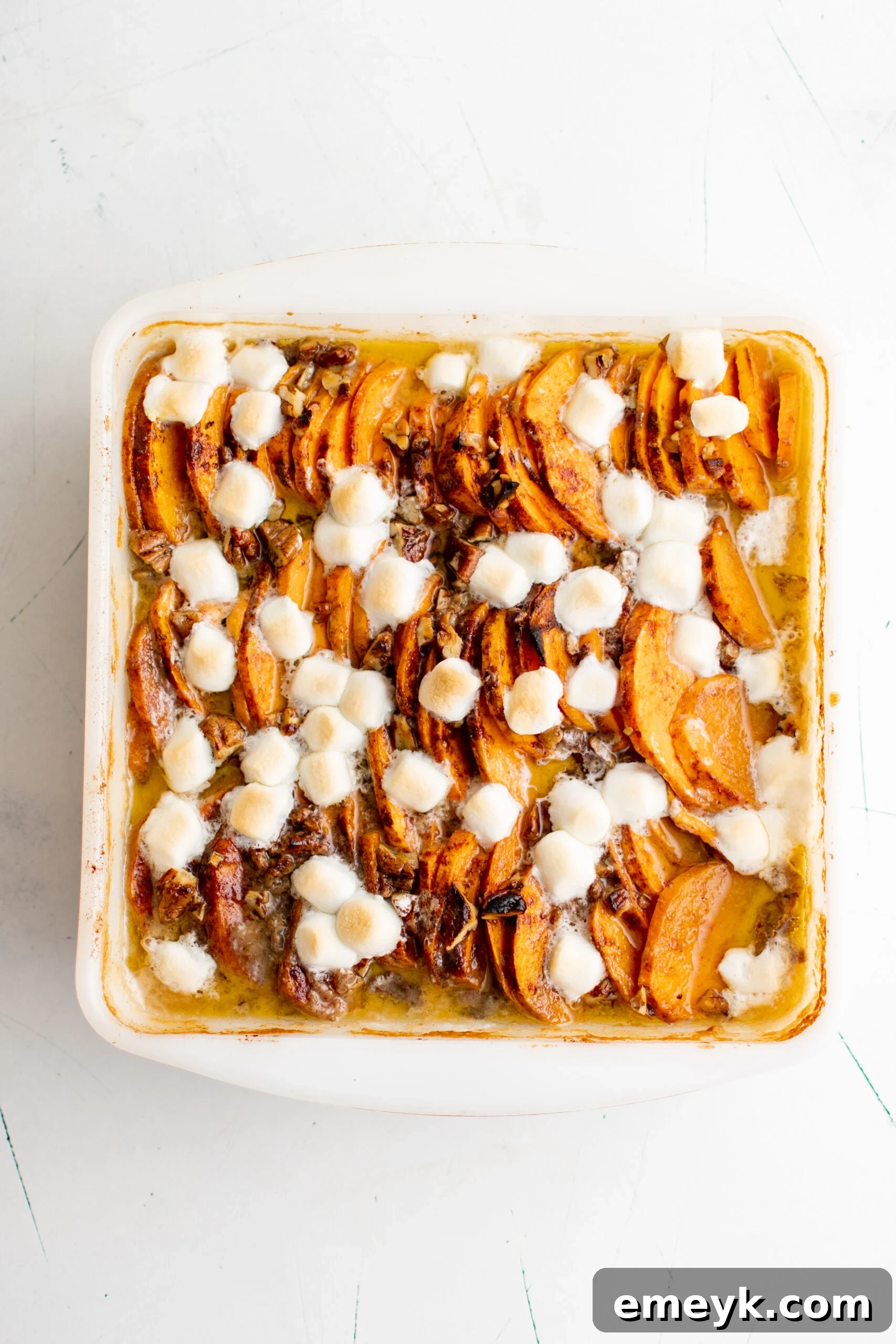 Easy Scalloped Sweet Potatoes with melted marshmallows on top.