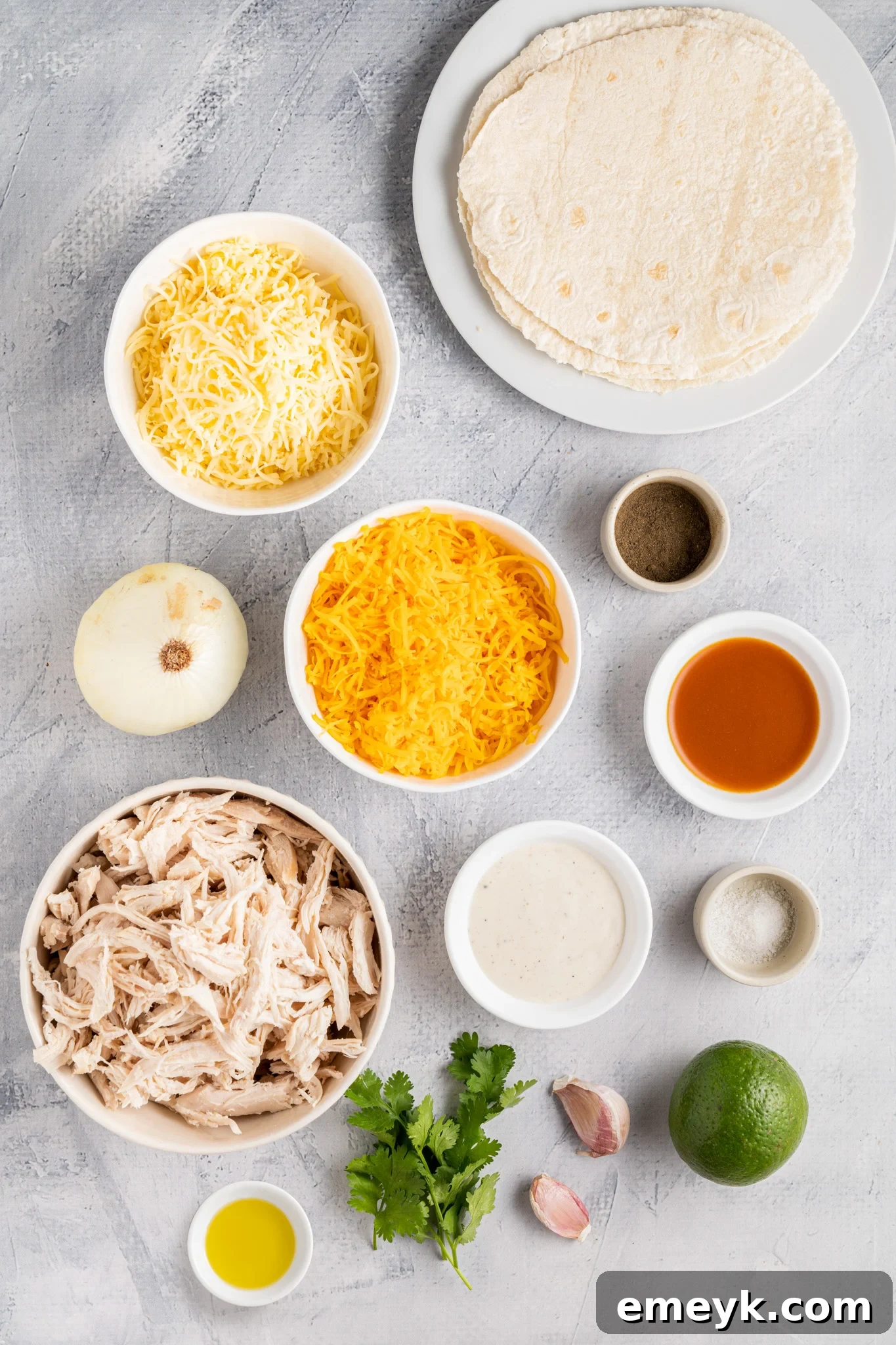 Quick Buffalo Chicken Quesadilla 3 Collection of fresh ingredients for Easy Buffalo Chicken Quesadilla laid out on a cutting board