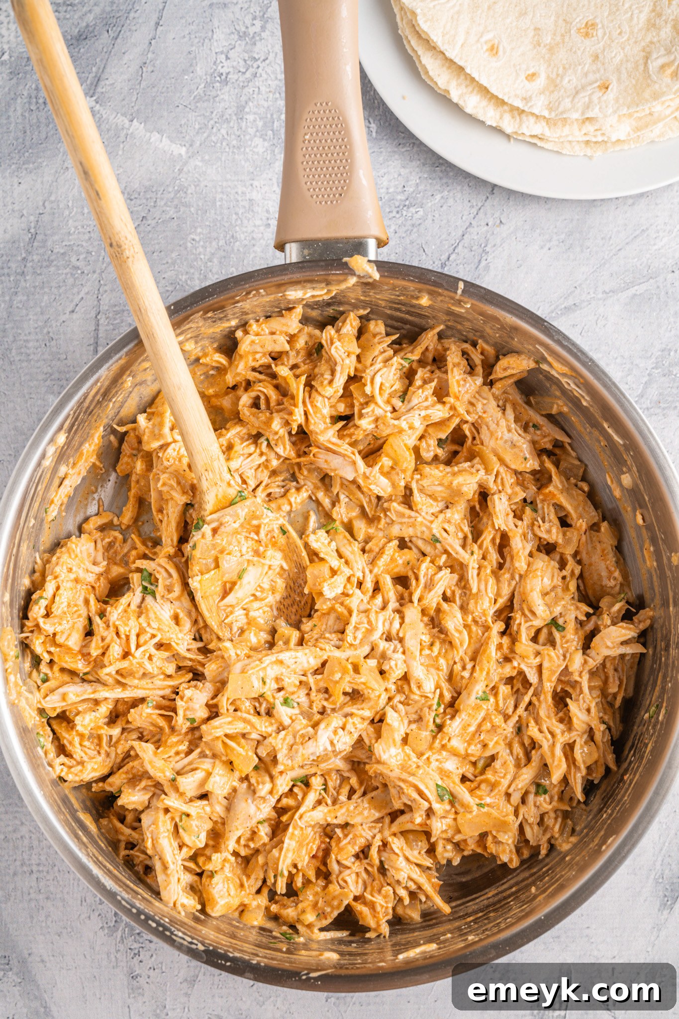Quick Buffalo Chicken Quesadilla 7 Buffalo chicken mixture fully combined in the skillet, ready for assembly