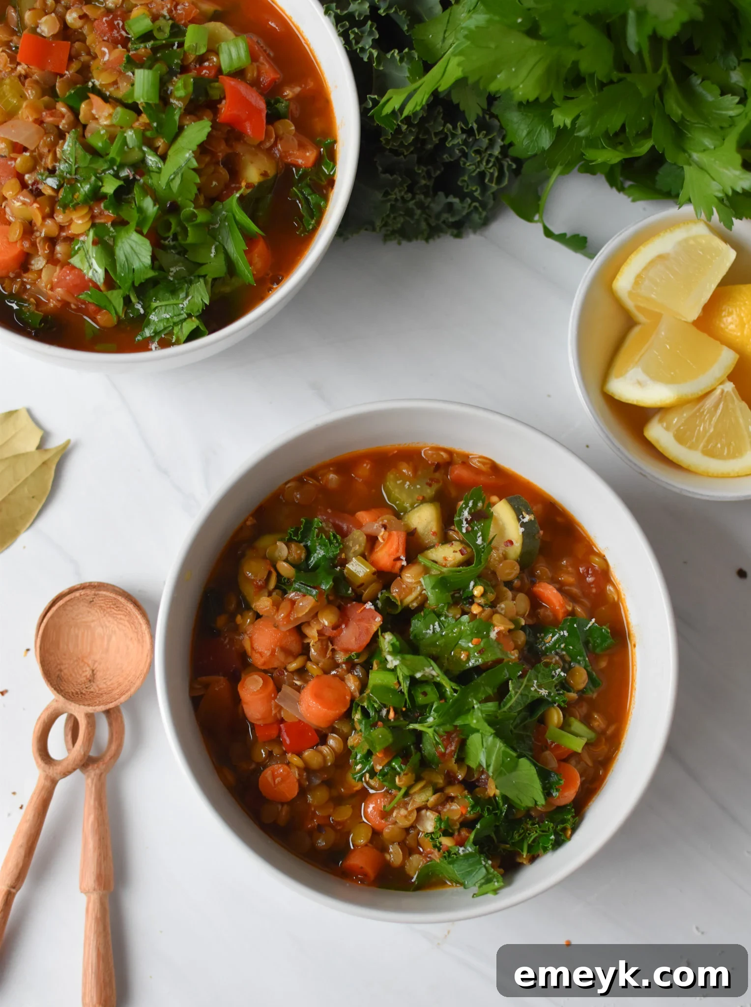 Italian Style Lentil Soup served in elegant white bowls, ready to eat.
