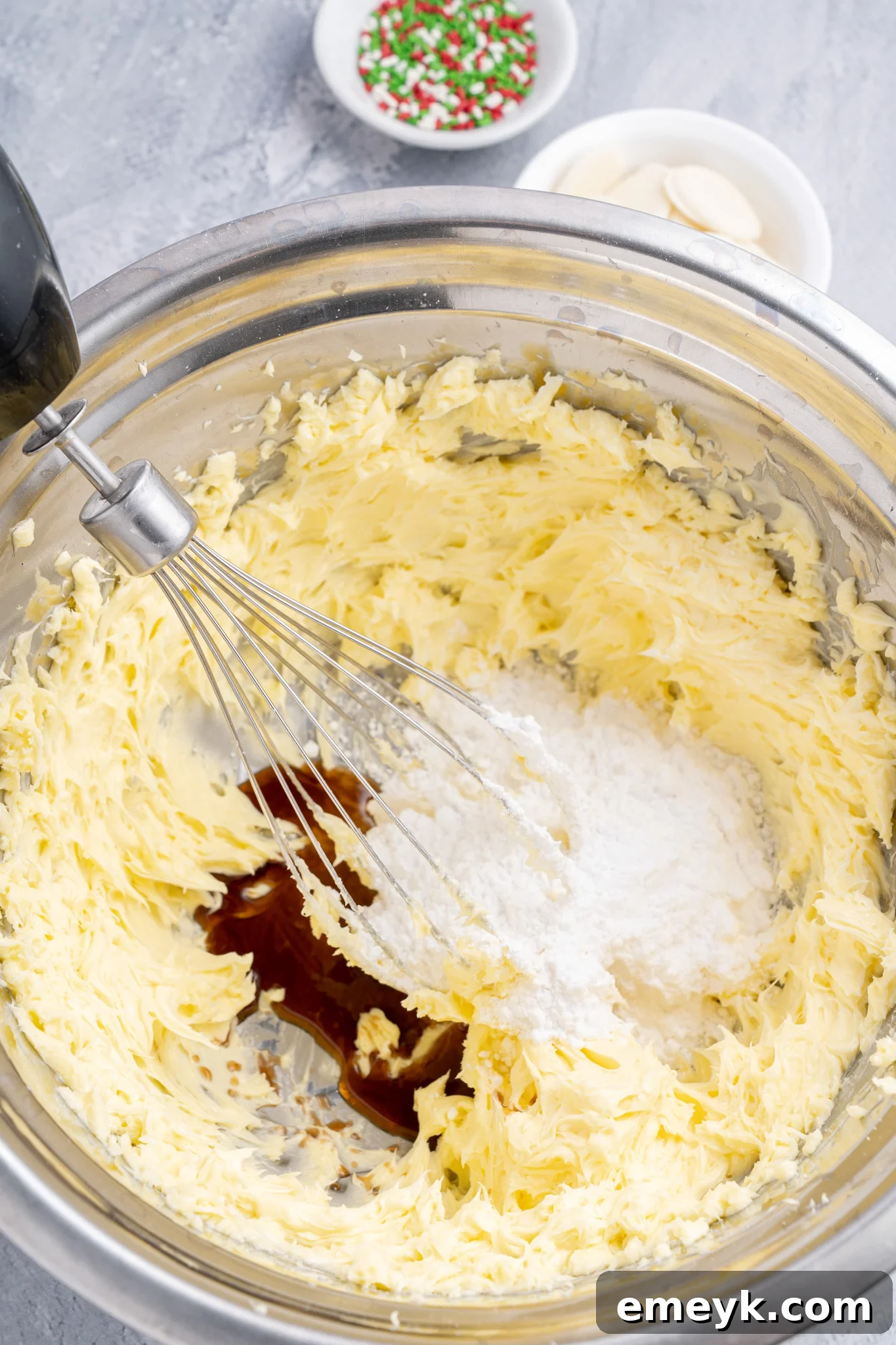 Ingredients for Christmas Shortbread Cookies being mixed in a bowl.